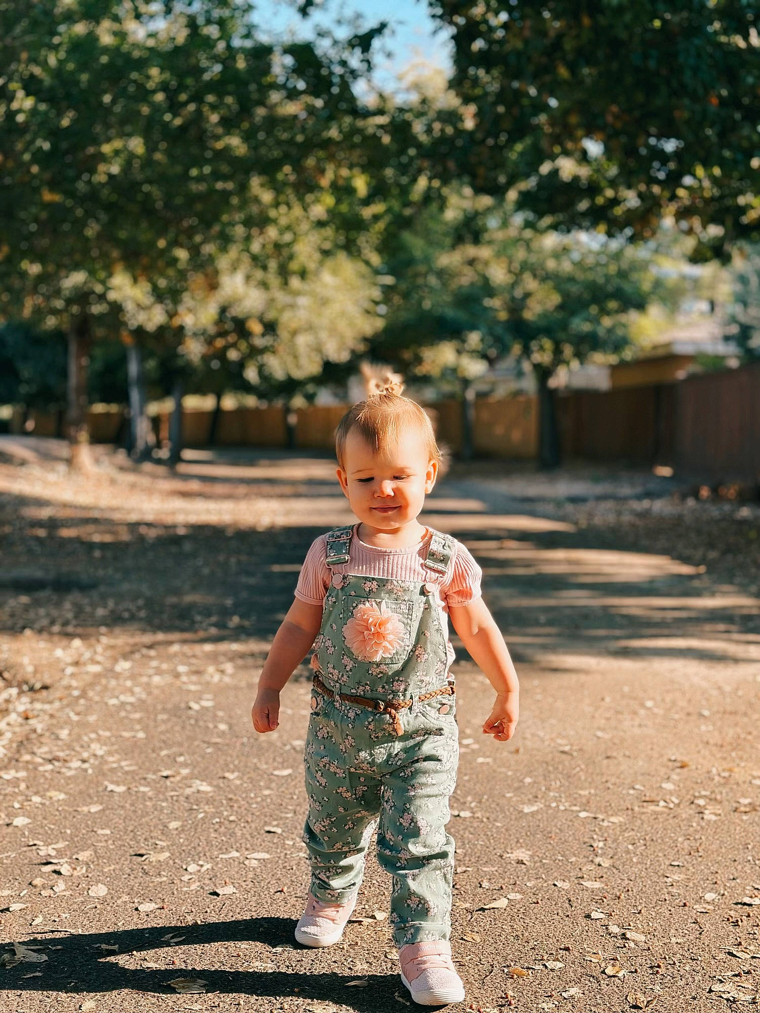Amara is registered to the contest to win money with this photo: asphalt, baby, baby_toddler_clothing, child, flash_photography, fun, grass, happy, leaf, leisure, people_in_nature, person, playing_with_kids, smile, soil, sunlight, tints_and_shades, toddler, tree, wood