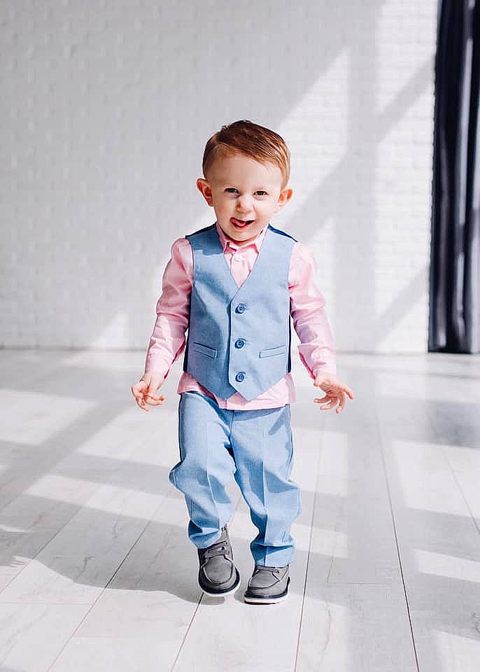 Timothy is registered to the contest to win money with this photo: baby, blue, child, child_model, denim, male, outerwear, person, photograph, photography, play, shoe, sleeve, smile, snapshot, standing, suit, toddler, white