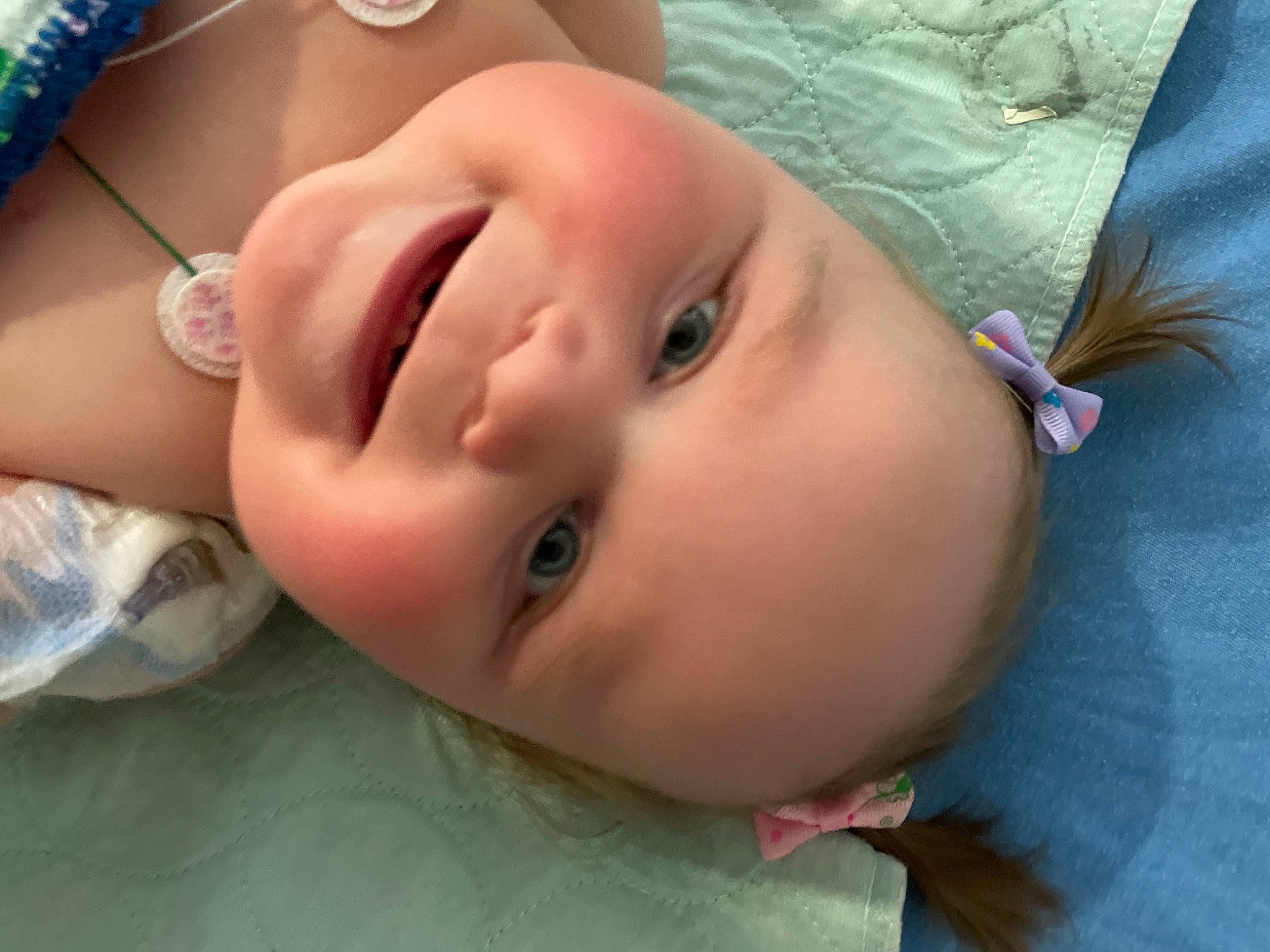 Zaylee is registered to the contest to win money with this photo: baby, baby_toddler_clothing, cheek, child, close_up, eye, eyebrow, eyelash, finger, grass, happy, human_body, iris, joy, lip, mouth, neck, nose, person, skin