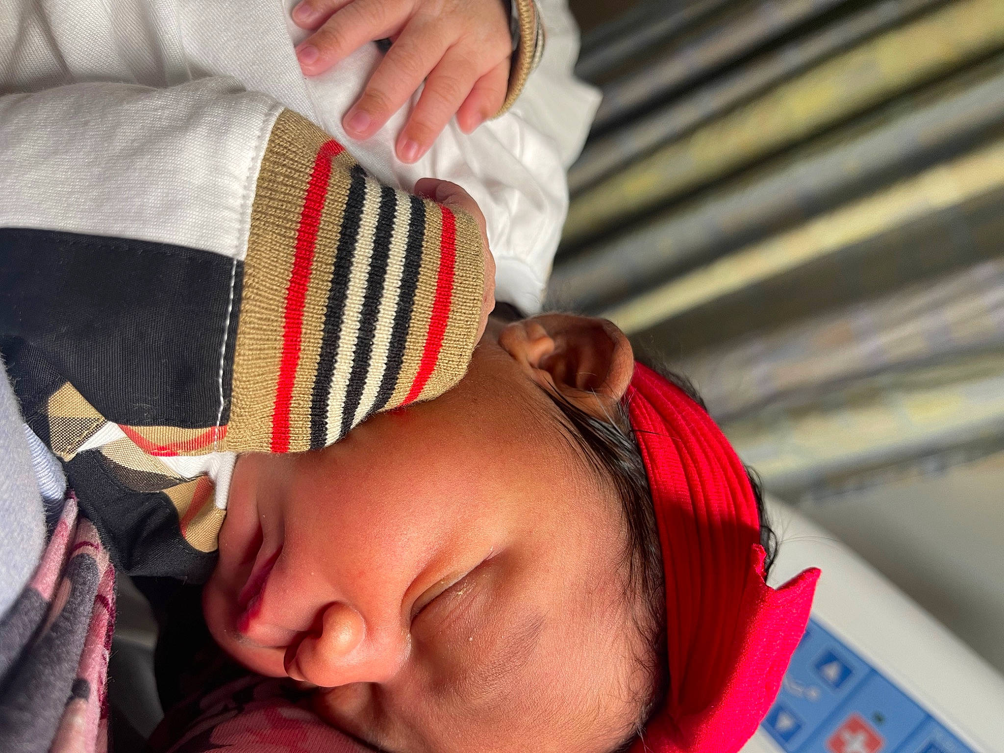 Jaycie is registered to the contest to win money with this photo: baby, child, close_up, comfort, elbow, eyelash, finger, gesture, happy, joint, mouth, nail, neck, nose, person, red, skin, sleeve, toddler, white