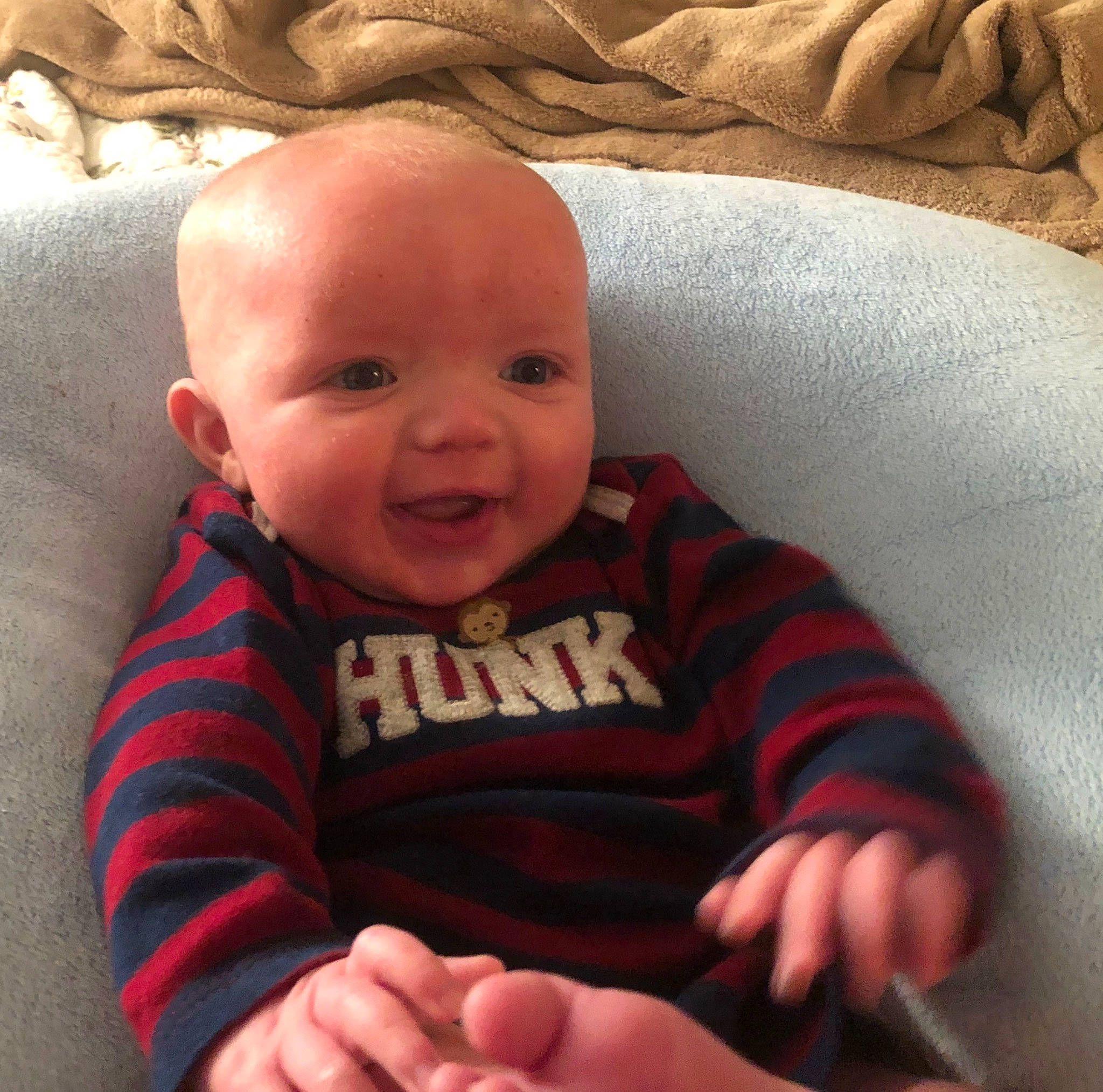 Pearson is registered to the contest to win money with this photo: baby, cheek, child, face, facial_expression, finger, hand, head, lip, mouth, nose, person, skin, smile, thumb, toddler