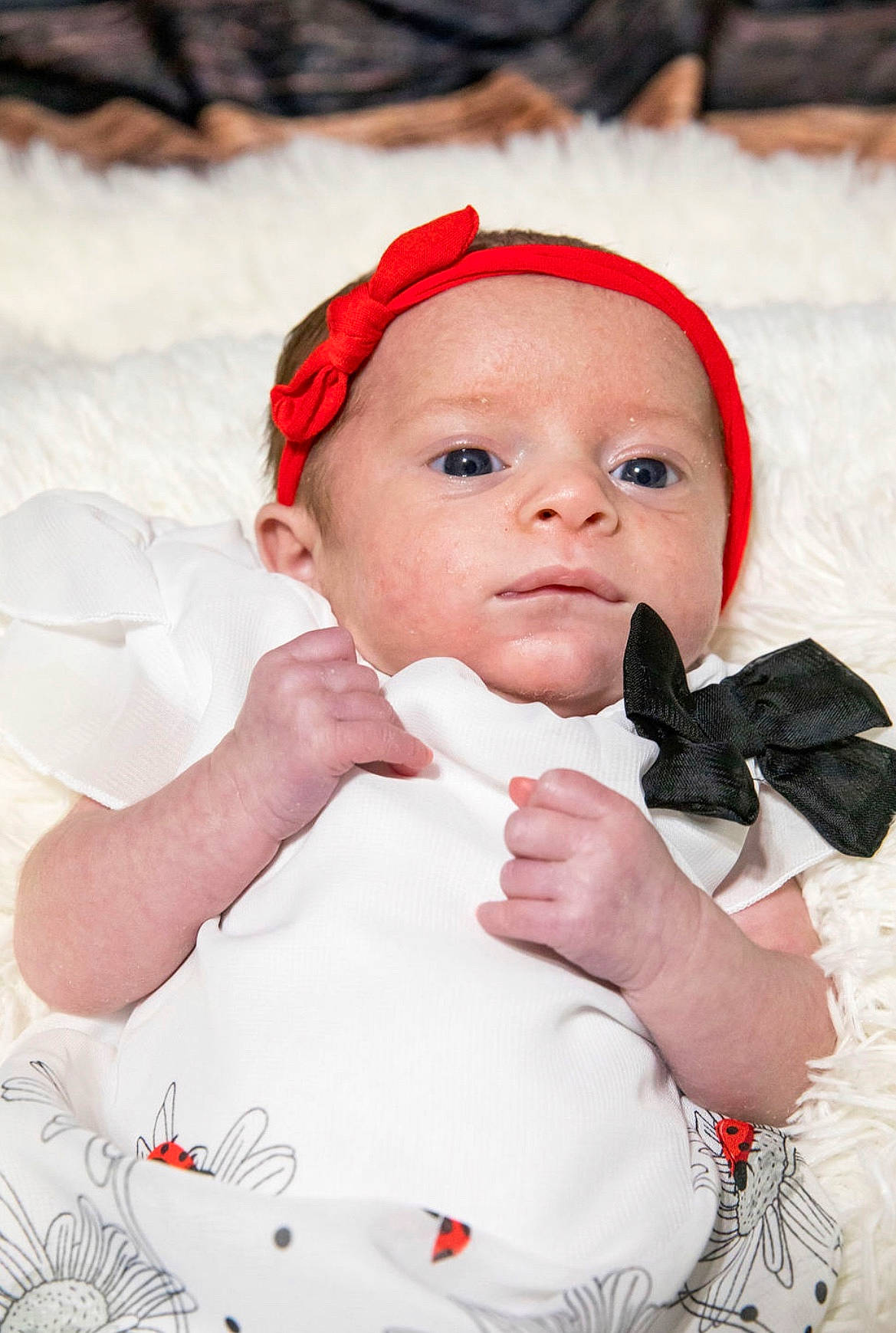 Hadley is registered to the contest to win money with this photo: baby, child, hair_accessory, headband, person, red, smile, toddler