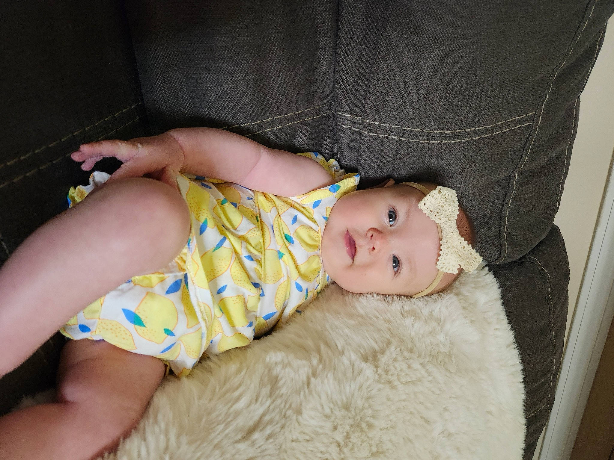 Macie joined the competition — help win amazing prizes! abdomen, baby, baby_toddler_clothing, cheek, child, comfort, couch, eye, foot, fur, grass, headwear, human_leg, knee, pattern, person, sitting, skin, sleeve, textile