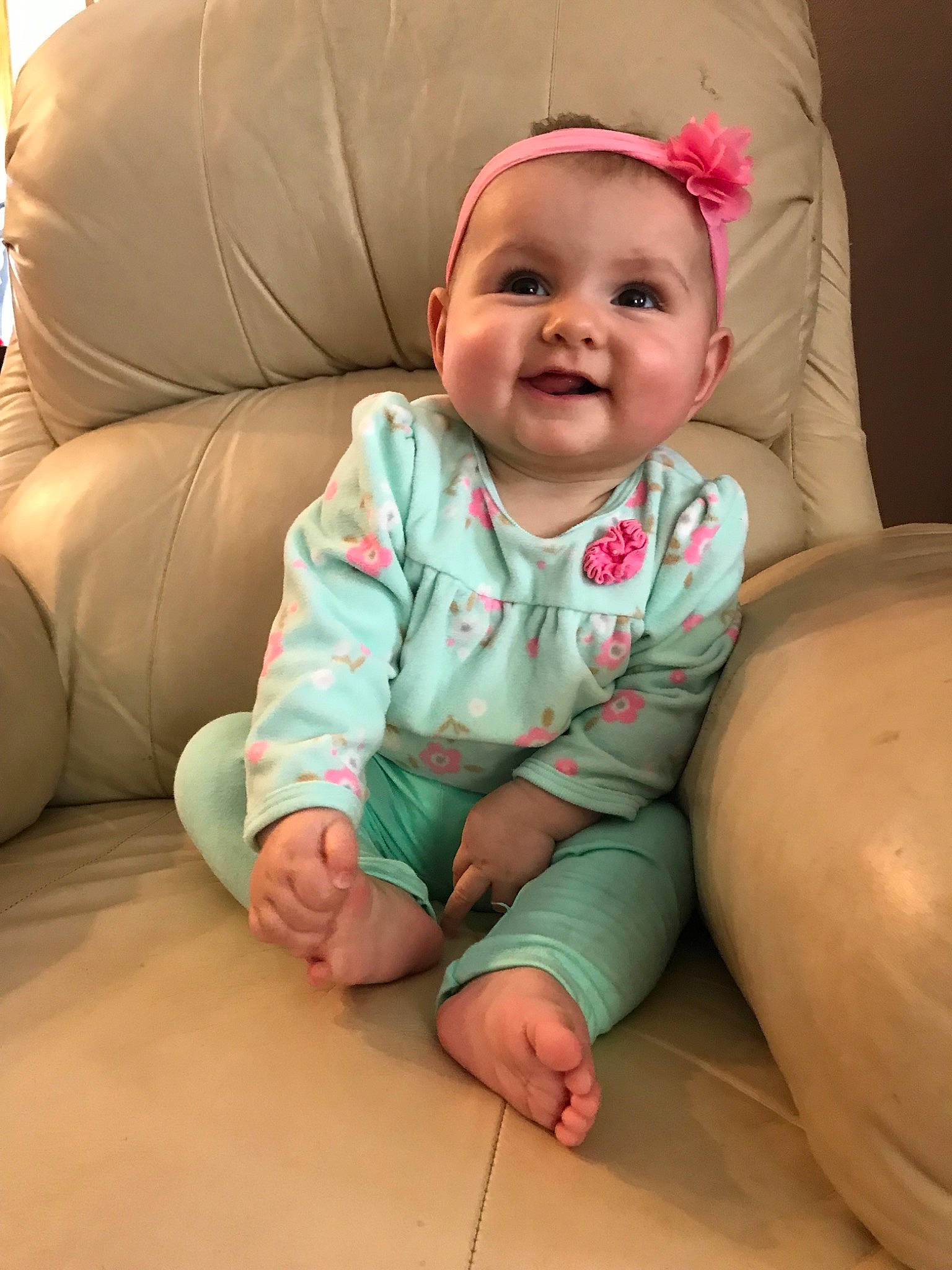 Raylynn is registered to the contest to win money with this photo: baby, cheek, child, comfort, face, head, person, play, sitting, skin, smile, toddler, tummy_time