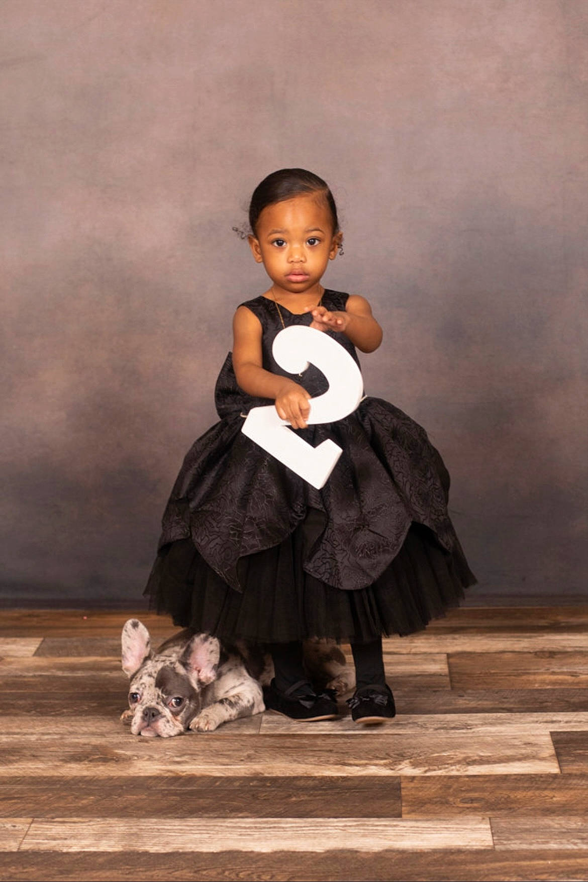 Ivy is registered to the contest to win money with this photo: baby, baby_toddler_clothing, child, entertainment, event, face, fashion_design, flash_photography, flooring, formal_wear, fun, happy, hardwood, performing_arts, person, sitting, toddler, vintage_clothing, wood