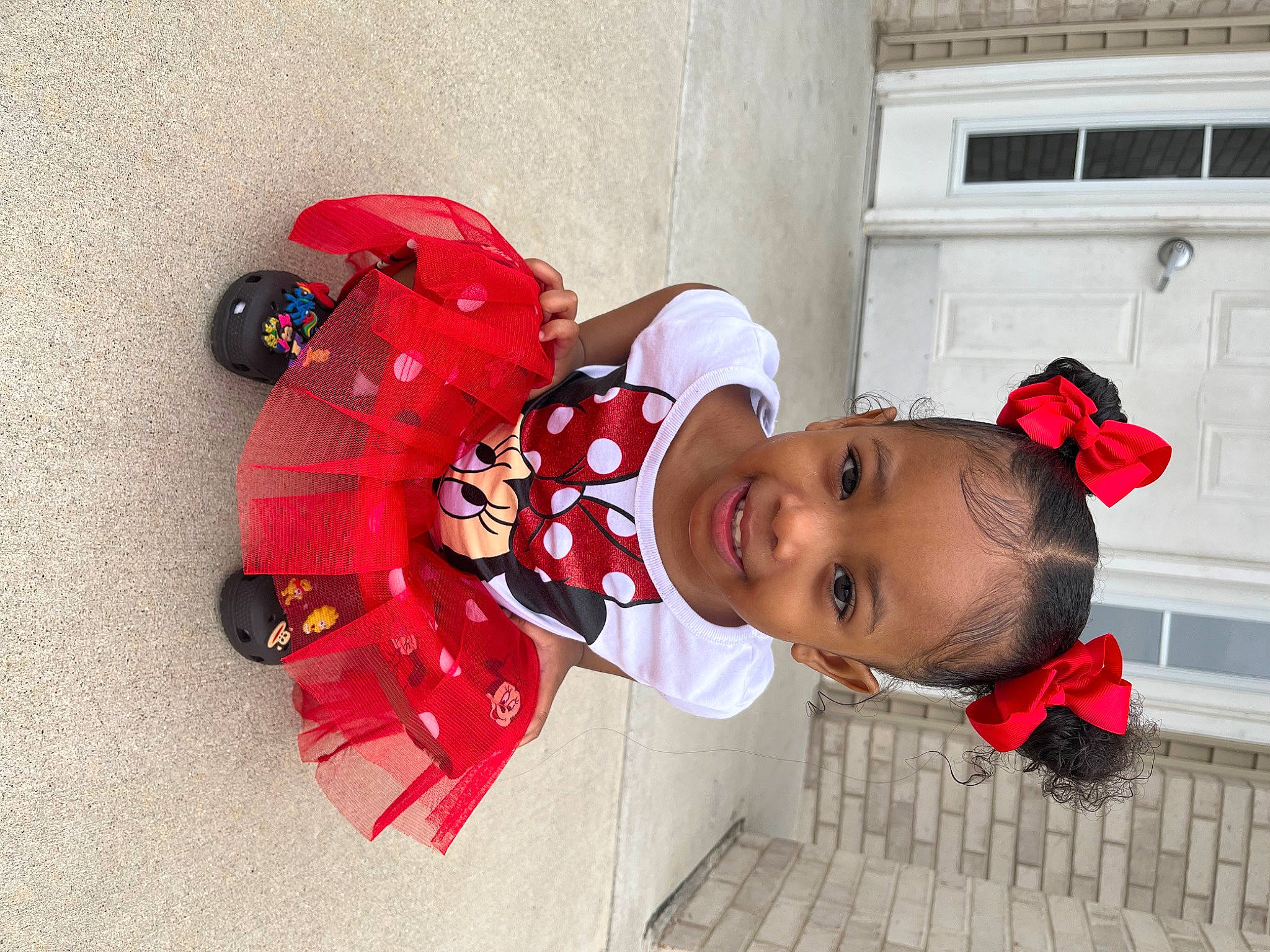 Ivy is registered to the contest to win money with this photo: baby, baby_toddler_clothing, carmine, child, coquelicot, costume, door, event, fun, happy, hat, joy, pattern, person, plant, red, smile, toddler, tradition, window