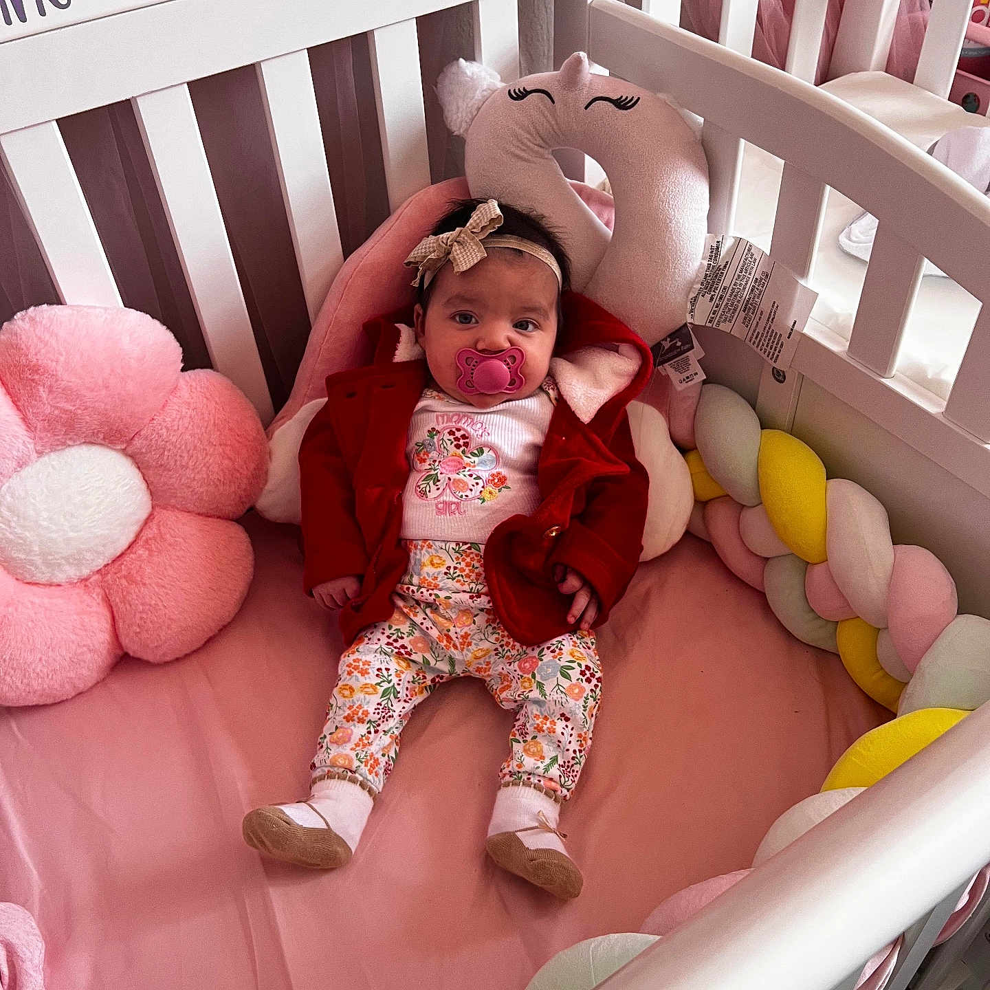 Zaelinne Hernandez joined the competition — help win amazing prizes! baby, bedding, booties, bow, braided_bumper, crib, crib_rail, floral_pants, headband, infant, newborn, nursery, onesie, pacifier, pillow, pink, plush_toy, red_coat, socks, stuffed_flower