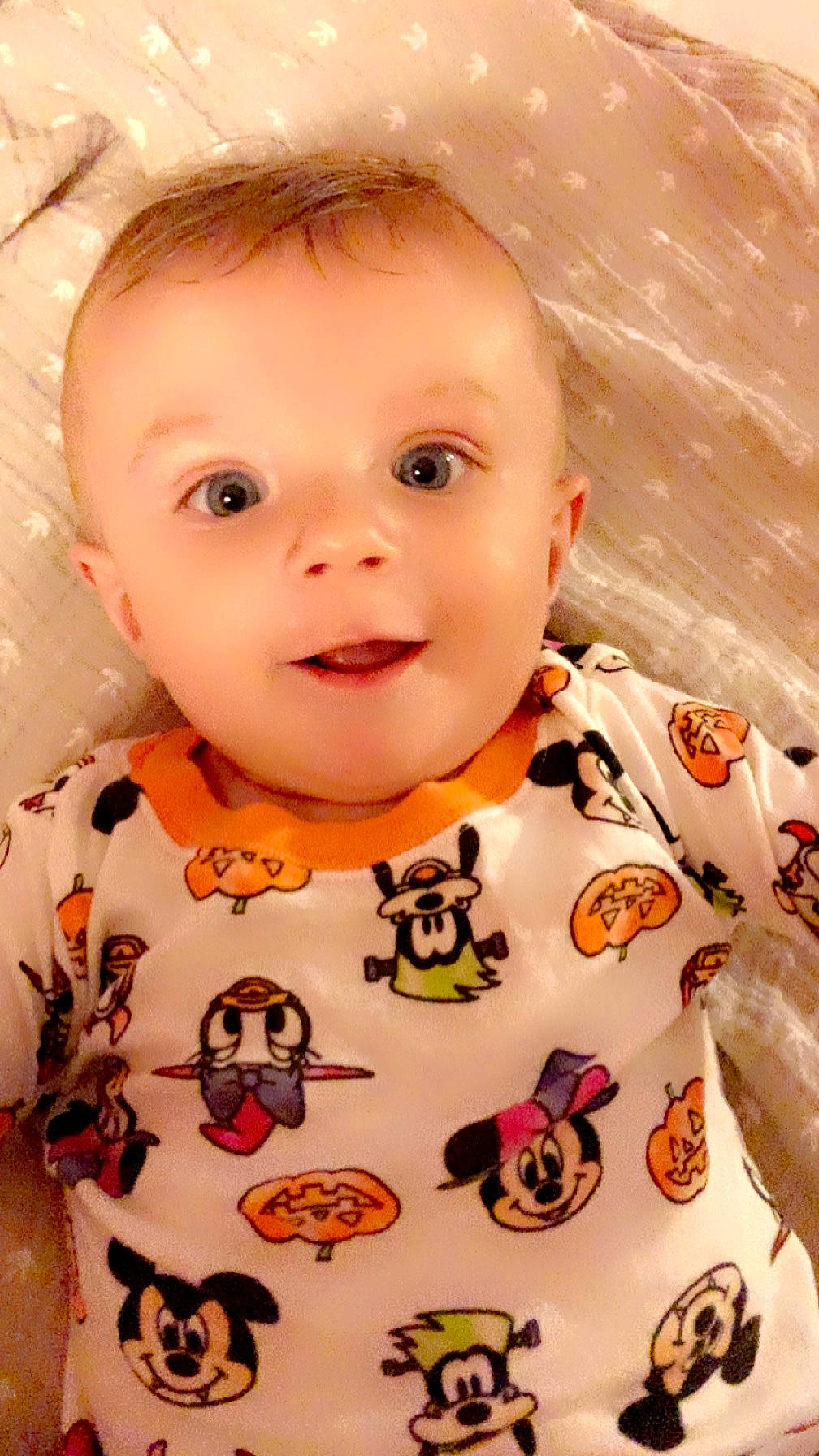 Joshua is registered to the contest to win money with this photo: baby, baby_toddler_clothing, cheek, chin, dress, eye, eyebrow, facial_expression, happy, human, iris, lip, nose, orange, person, pink, product, skin, sleeve, smile