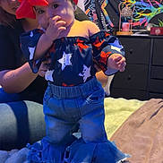 Melonie Me-Lon-e joined the competition — help win amazing prizes! toddler, child, adult, bed, headband, red_bow, jeans, off_shoulder_top, stars_pattern, colorful_tapestry, award_poster, furniture, indoor, person, supporting_hand, blanket, home, smiling, cute, cozy