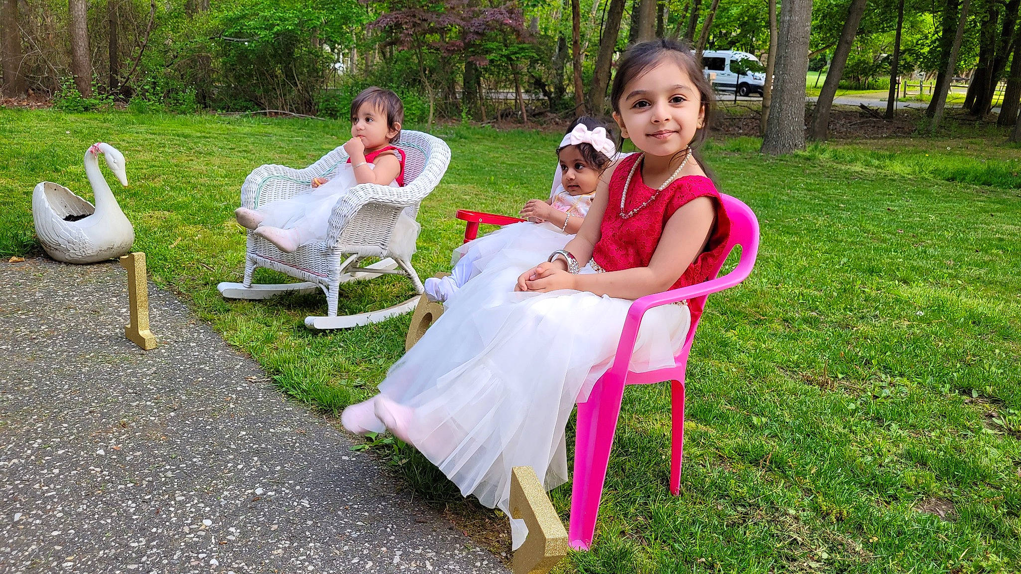 Aryaa is registered to the contest to win money with this photo: botany, chair, dress, event, face, fun, furniture, grass, happy, headwear, joy, lawn, leisure, mammal, outdoor_furniture, people_in_nature, person, pink, plant, recreation