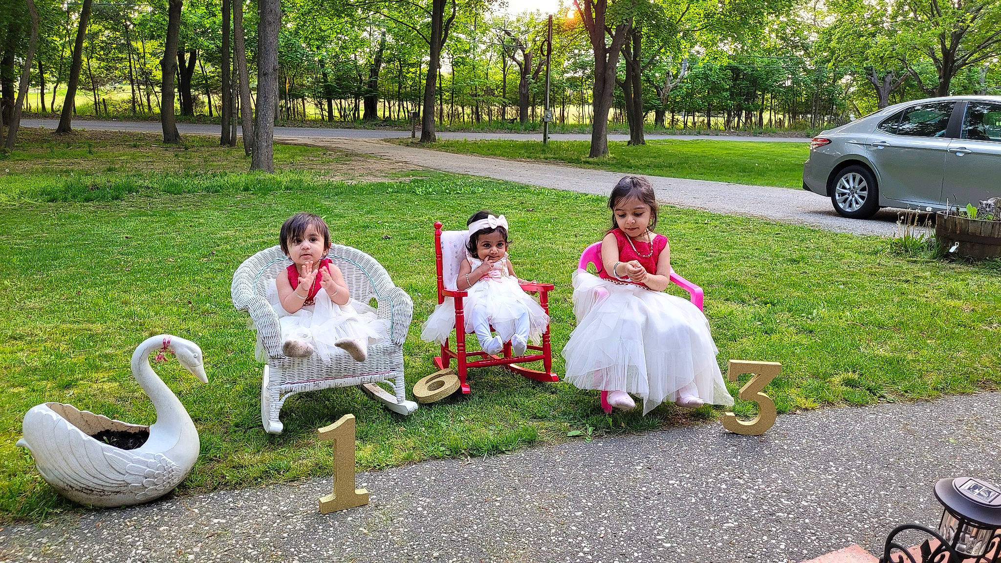 Aryaa is registered to the contest to win money with this photo: botany, car, dress, event, fun, grass, green, happy, lawn, leaf, leg, leisure, people, people_in_nature, person, plant, public_space, recreation, tire, tree