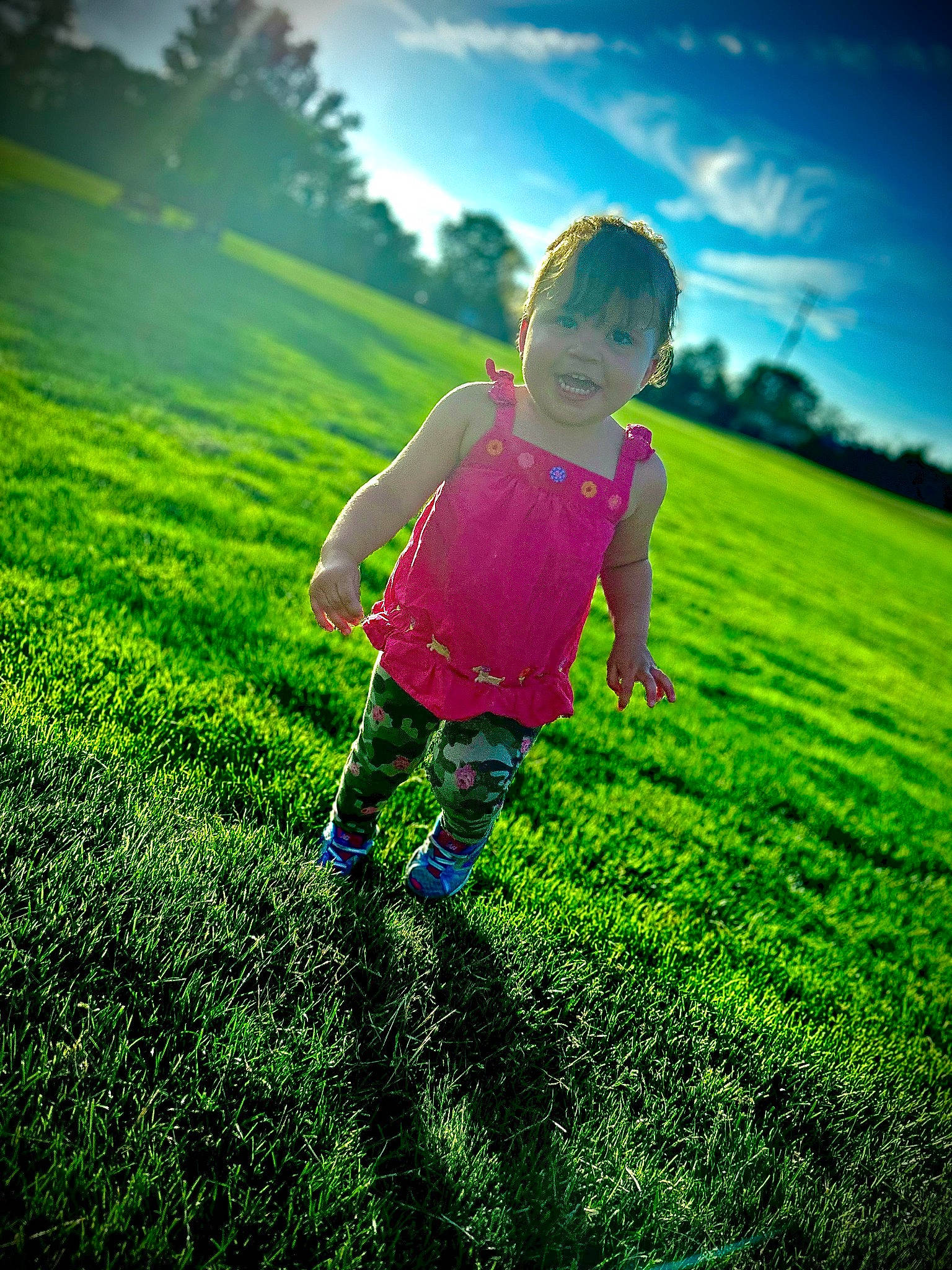 Thalia joined the competition — help win amazing prizes! cloud, flash_photography, fun, gesture, grass, grassland, green, happy, landscape, leisure, natural_landscape, people_in_nature, person, plain, plant, sky, sunlight, tints_and_shades, toddler, tree