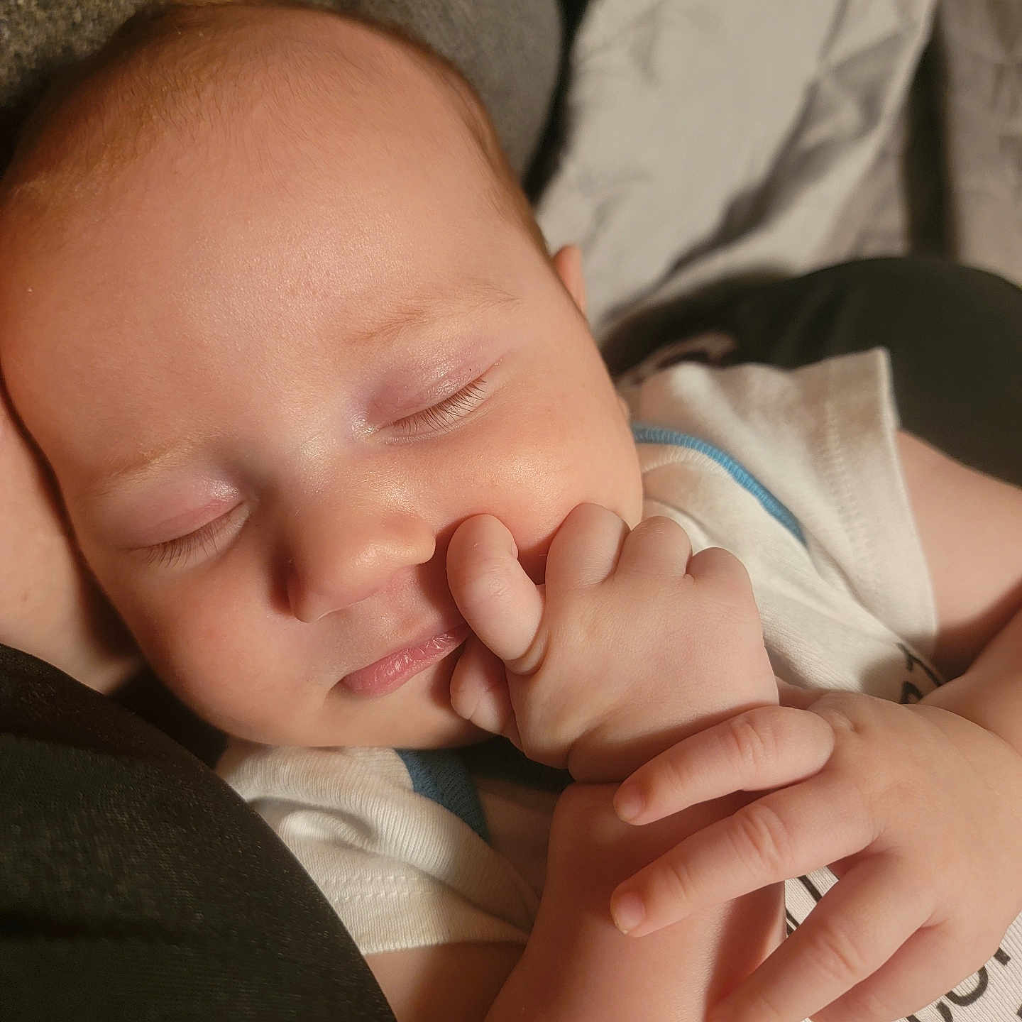 Donavon is registered to the contest to win money with this photo: baby, child, closeup, clothing, cozy, cute, expression, face, hand, infant, nap, newborn, peaceful, person, portrait, resting, skin, sleeping, soft_lighting, tender