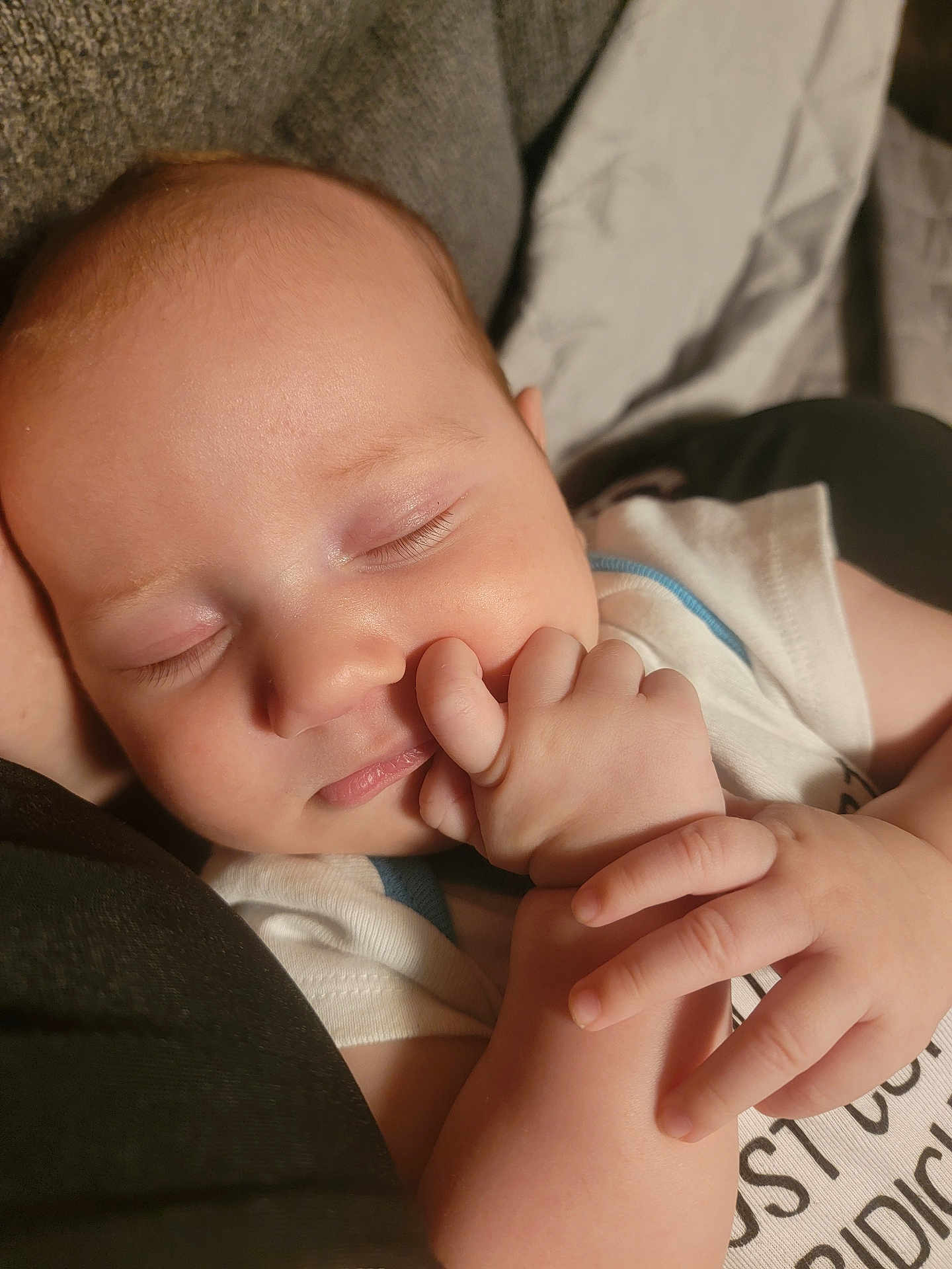 Donavon is registered to the contest to win money with this photo: baby, sleeping, hand, closeup, face, infant, peaceful, cute, skin, expression, child, portrait, soft_lighting, tender, cozy, clothing, nap, resting, newborn, person