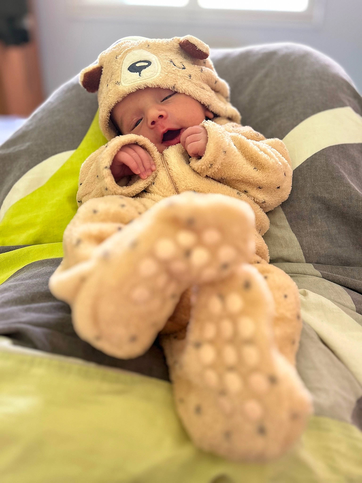 Kayden participe au concours pour gagner de l'argent avec cette photo : baby, baby_products, baby_sleeping, baby_toddler_clothing, child, comfort, fawn, foot, fur, gesture, human_body, linens, nail, person, plush, sitting, stuffed_toy, teddy_bear, thumb, toddler