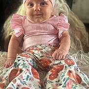 Mazeleigh joined the competition — help win amazing prizes! baby, pink_bow, headband, smile, pink_top, ruffled_sleeves, floral_pants, pumpkin_pattern, barefoot, sitting, fluffy_surface, cute, infant, portrait, indoor, soft_lighting, happy, child, closeup, adorable