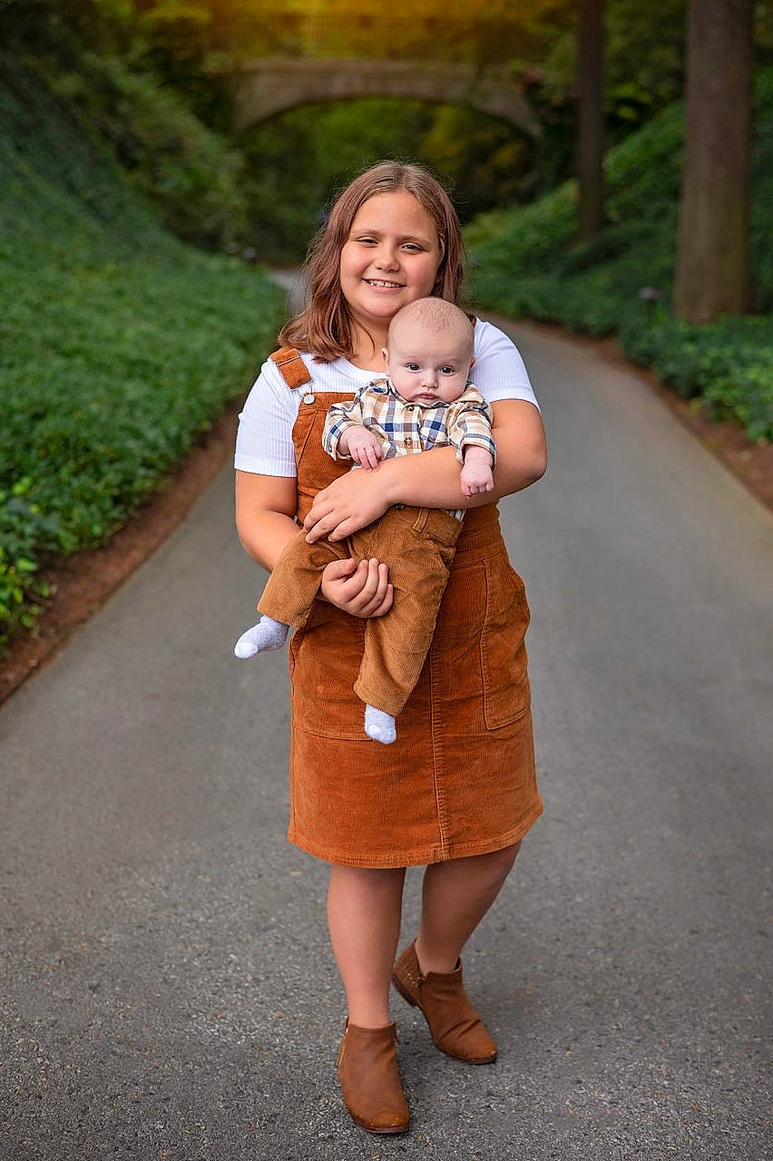Kaelyn joined the competition — help win amazing prizes! baby, eye, face, facial_expression, fawn, flash_photography, fun, gesture, grass, hair, hairstyle, happy, head, human_body, joy, leisure, people_in_nature, person, plant, skin