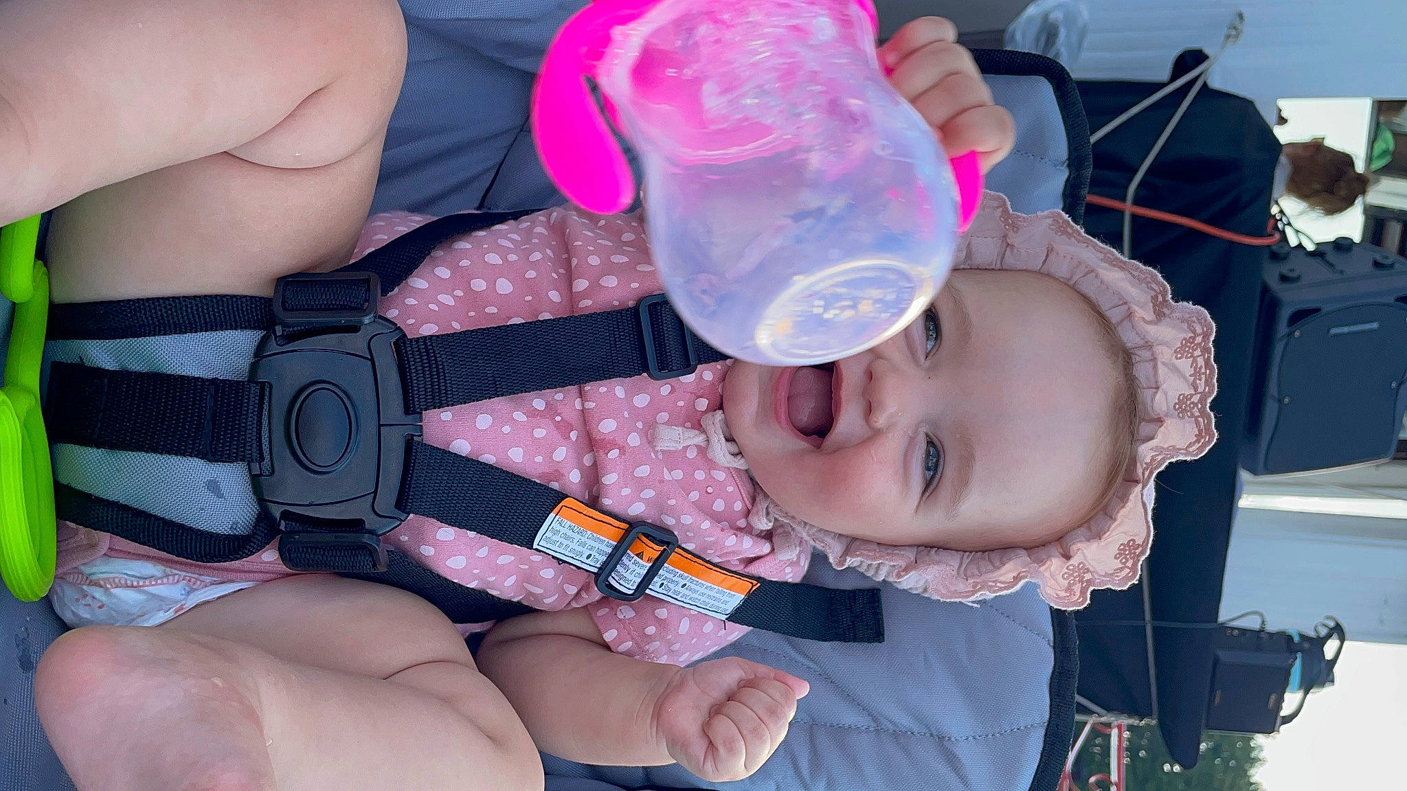 Adelaide is registered to the contest to win money with this photo: baby, baby_products, baby_toddler_clothing, camera, cheek, child, drinkware, fun, hand, mouth, nail, person, pink, plastic_bottle, reflex_camera, skin, smile, thumb, toddler, water
