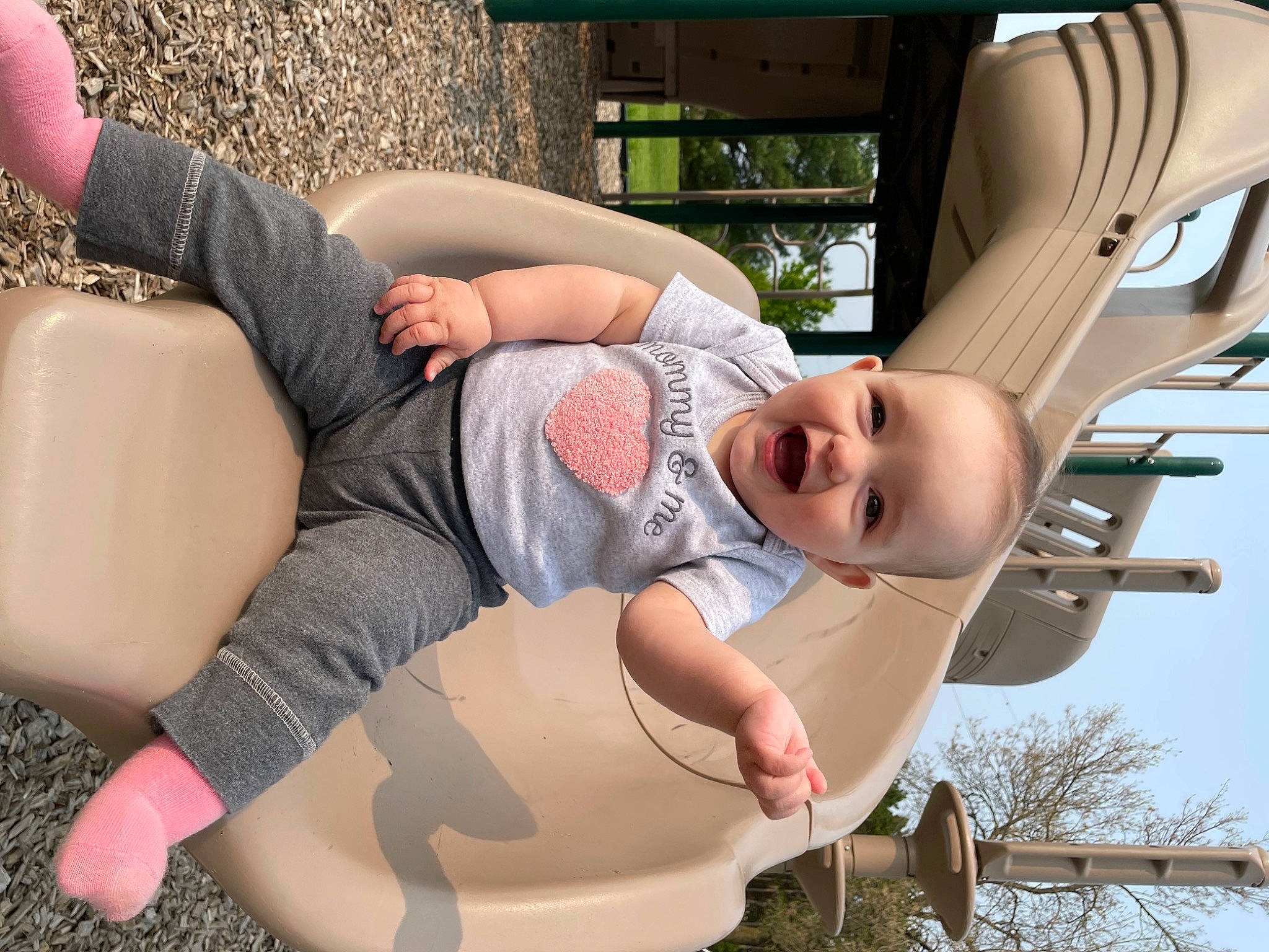 Adelaide is registered to the contest to win money with this photo: arm, baby, comfort, cool, eyewear, finger, flash_photography, fun, grass, hairstyle, happy, human_body, joint, knee, leg, leisure, mouth, person, plant, thigh