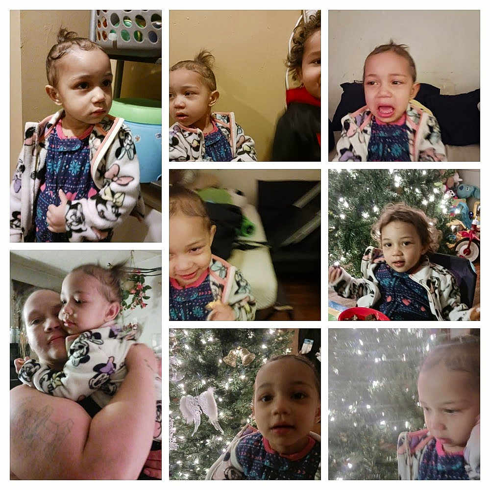 Skyla'Aria is registered to the contest to win money with this photo: candid, child, christmas_tree, closeup, clothing, crying, curly_hair, expression, family, furniture, holiday_decor, home, hugging, indoor, jacket, person, portrait, smiling, toddler, toy