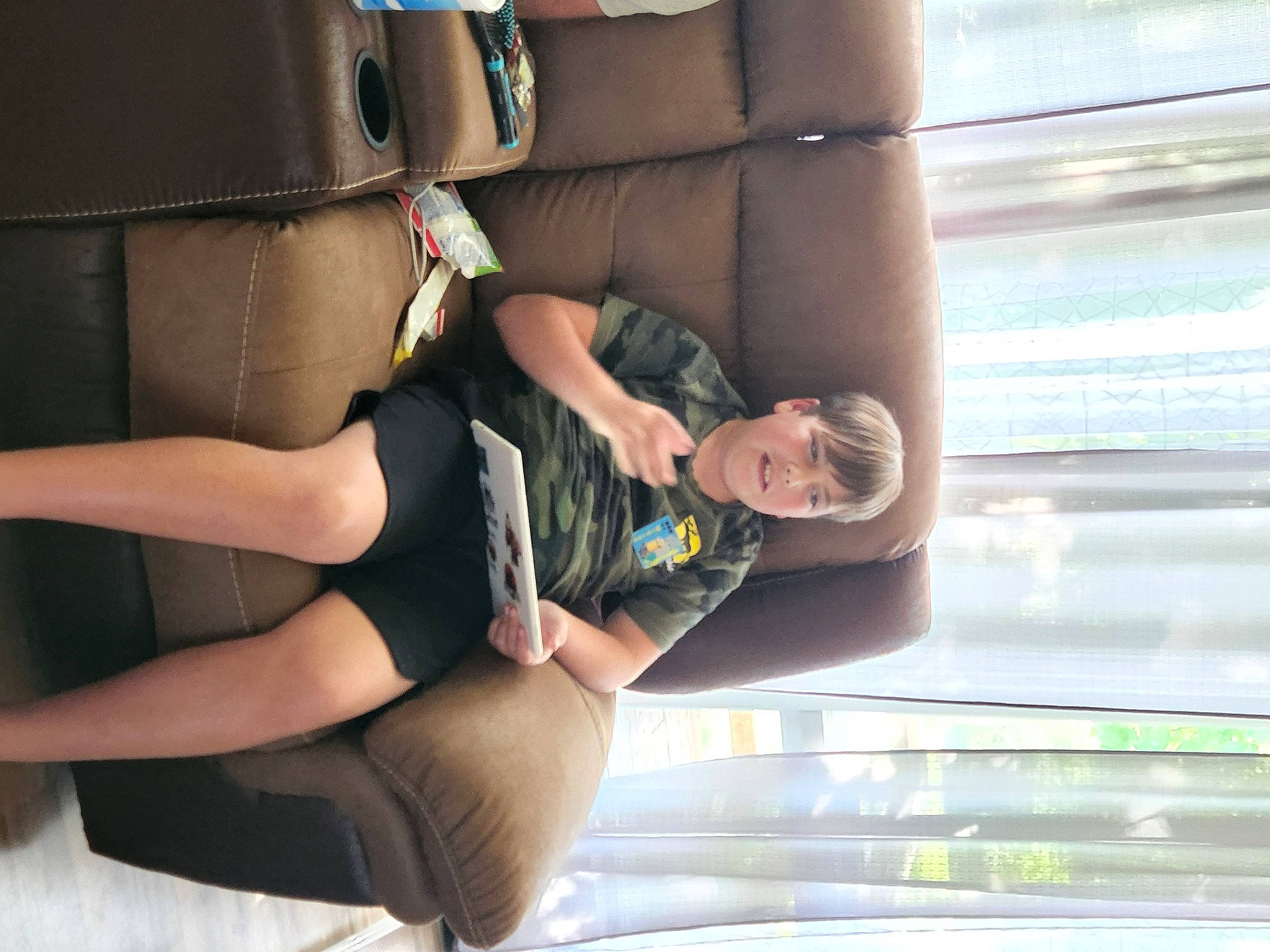 Jesse is registered to the contest to win money with this photo: arm, automotive_design, comfort, dress, elbow, eyewear, gesture, goggles, hand, human_body, human_leg, joint, knee, leg, leisure, person, shorts, shoulder, sunglasses, thigh