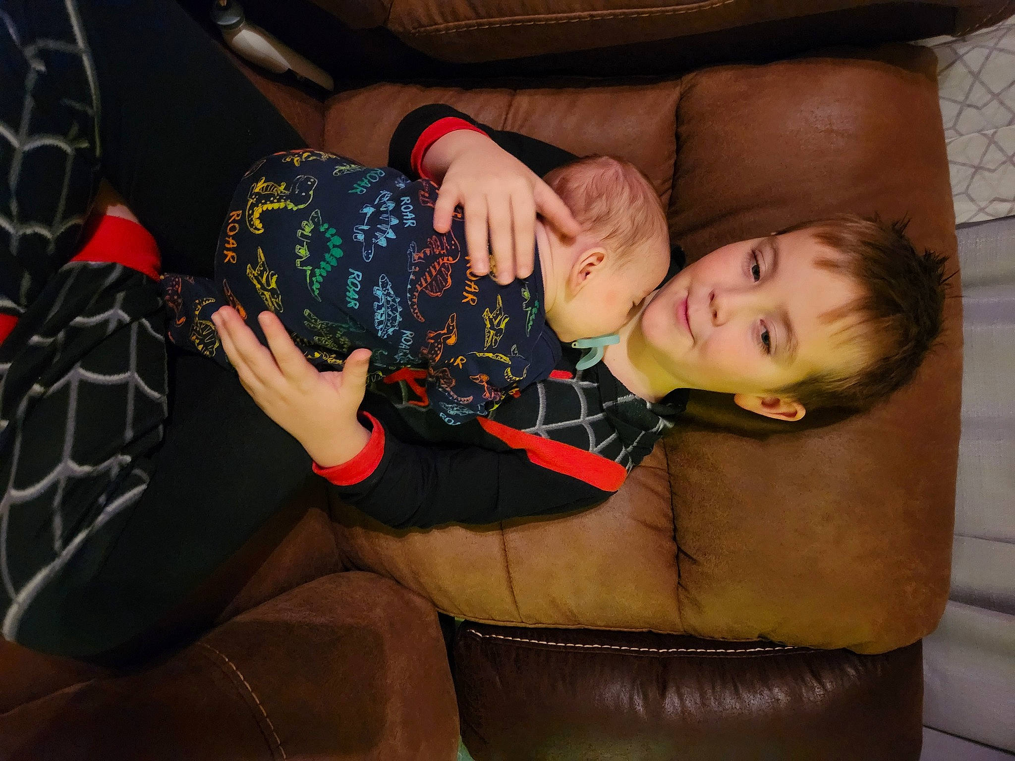 Sawyer joined the competition — help win amazing prizes! arm, child, comfort, couch, elbow, finger, flash_photography, fun, gesture, human_leg, lap, mouth, nail, pattern, person, sitting, thigh, thumb, toddler, tree