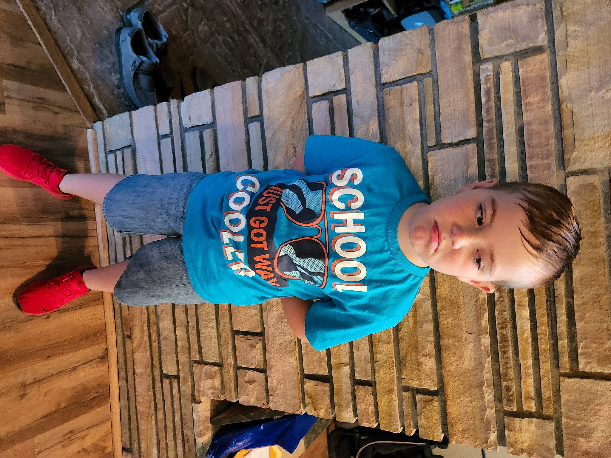 Sawyer is registered to the contest to win money with this photo: child, electric_blue, flooring, fun, happy, hardwood, leisure, pattern, people, person, sitting, snapshot, t_shirt, thigh, toddler, travel, vacation, wood, wood_stain, world