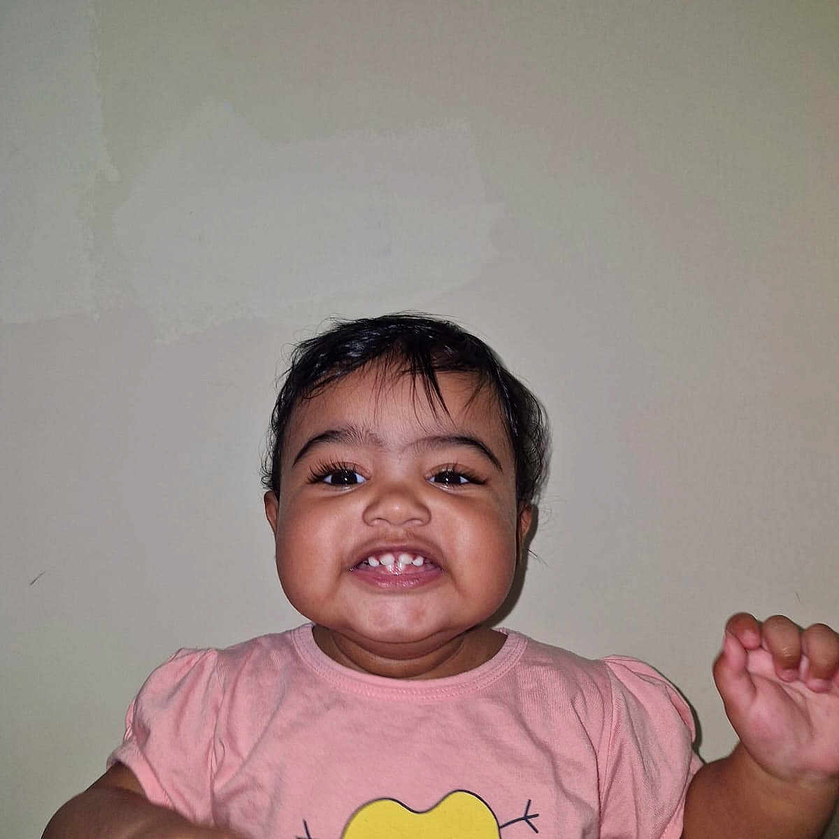 Tisha joined the competition — help win amazing prizes! baby, cheeks, child, cute, eyes, face, hands, happy, heart_graphic, indoor, motion_blur, mouth, person, pink_shirt, portrait, short_hair, skin, smile, toddler, wall