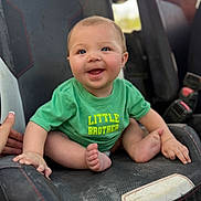 Colter joined the competition — help win amazing prizes! baby, blue_eyes, candid, car_seat, casual_clothing, child, closeup, fabric, feet, green_shirt, hands, happy, infant, little_brother, portrait, rosy_cheeks, sitting, smiling, toddler, vehicle_interior