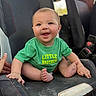 baby, blue_eyes, candid, car_seat, casual_clothing, child, closeup, fabric, feet, green_shirt, hands, happy, infant, little_brother, portrait, rosy_cheeks, sitting, smiling, toddler, vehicle_interior