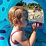 Méa participe au concours pour gagner de l'argent avec cette photo : blue, bottle, child, drinking, hair, inflatable_pool, nature, outdoor, people, red, relaxing, river, rocks, sitting, skin, summer, sunlight, swimsuit, toddler, water