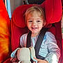 Méa participe au concours pour gagner de l'argent avec cette photo : toddler, child, car_seat, red, plush_toy, bunny, smile, happy, safety_belt, window, sunlight, indoor, clothing, cute, person, seat, seatbelt, toy, young_child, car_interior