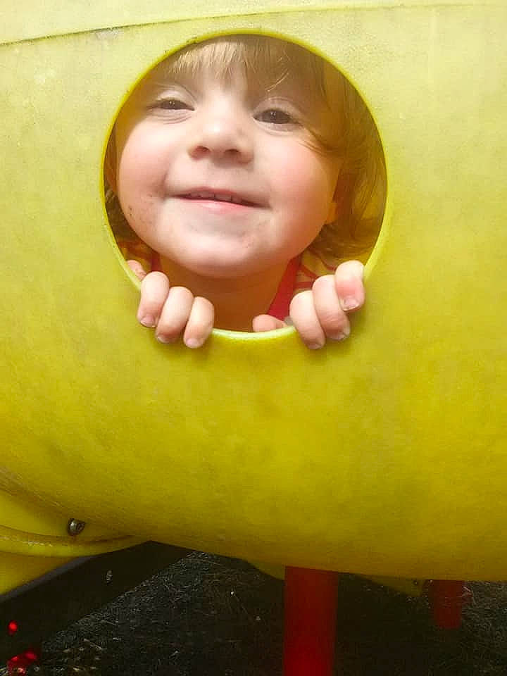 Stormie is registered to the contest to win money with this photo: cheek, child, chin, emotion, face, facial_expression, fun, hand, happiness, head, infant, joy, laughter, lip, mouth, nose, person, plant, skin, smile