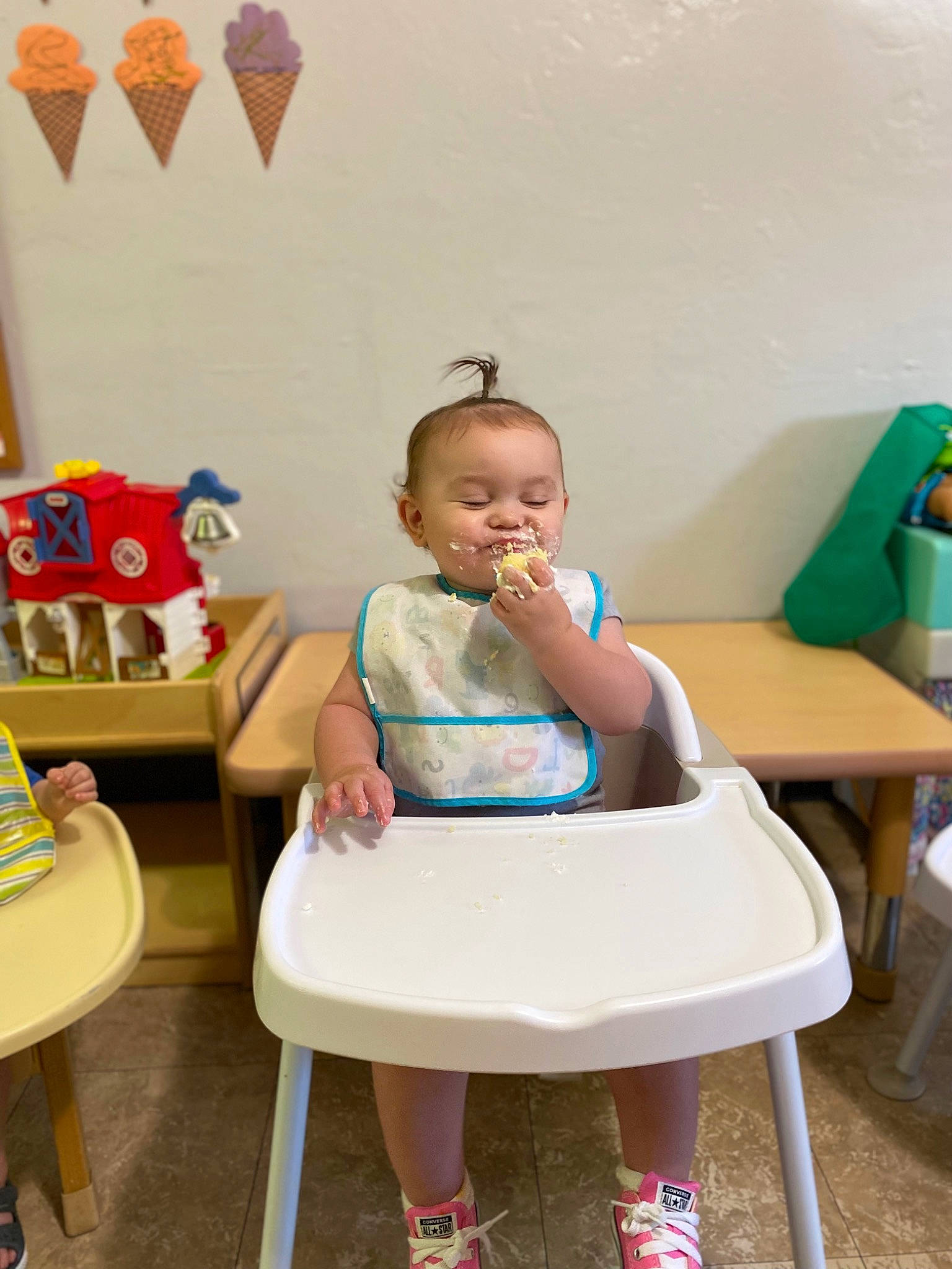 Emberlyn is registered to the contest to win money with this photo: baby, baby_toddler_clothing, chair, child, comfort, event, furniture, happy, human_leg, leisure, magenta, person, picture_frame, play, room, sandal, sitting, toddler, wheel, wood