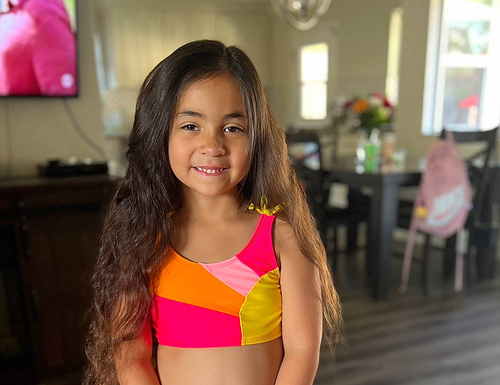 Penelope is registered to the contest to win money with this photo: abdomen, black_hair, chair, chest, event, eye, flooring, fun, happy, joy, leisure, lingerie_top, long_hair, navel, person, smile, swimwear, thigh, trunk, undergarment