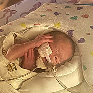 Zenalla joined the competition — help win amazing prizes! newborn, baby, infant, blanket, medical_tube, hospital, sleeping, wrapped, cute, tiny, face, hand, healthcare, premature, soft, colorful, heart_pattern, peaceful, child, person