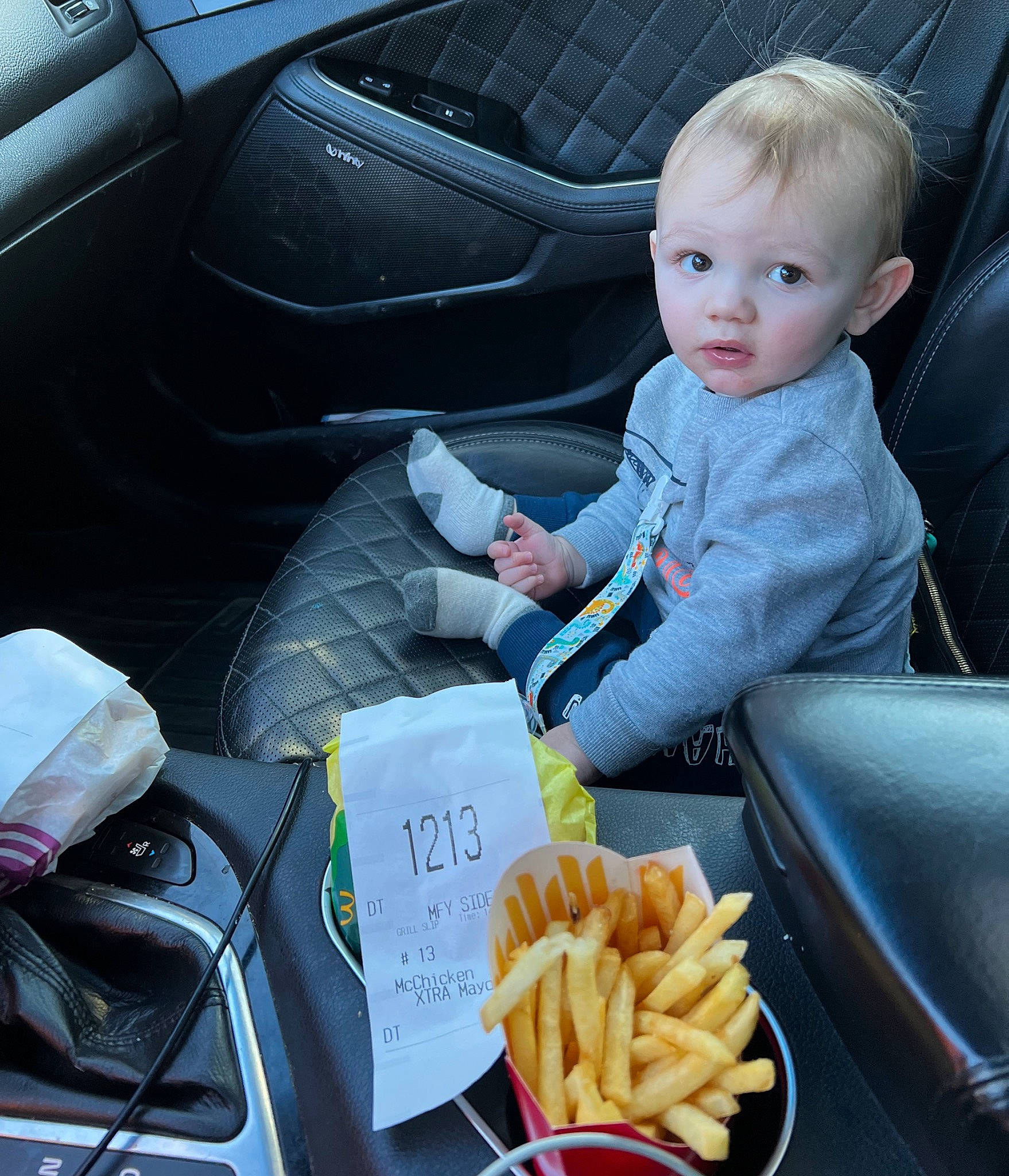 Karson is registered to the contest to win money with this photo: auto_part, automotive_design, car, car_seat, car_seat_cover, comfort, cuisine, deep_frying, family_car, fast_food, food, french_fries, ingredient, motor_vehicle, person, personal_luxury_car, sitting, snapshot, tableware, toddler
