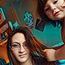 Bella is registered to the contest to win money with this photo: adult, blue_clothing, casual, child, decoration, face, family, fun, glasses, hair, indoor, interaction, person, playful, portrait, room, skull_art, smile, woman, young_child