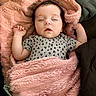 baby, sleeping, pink_blanket, pacifier, onesie, heart_pattern, infant, cute, soft_texture, cozy, resting, child, newborn, peaceful, indoors, portrait, face, hand, furniture, blanket