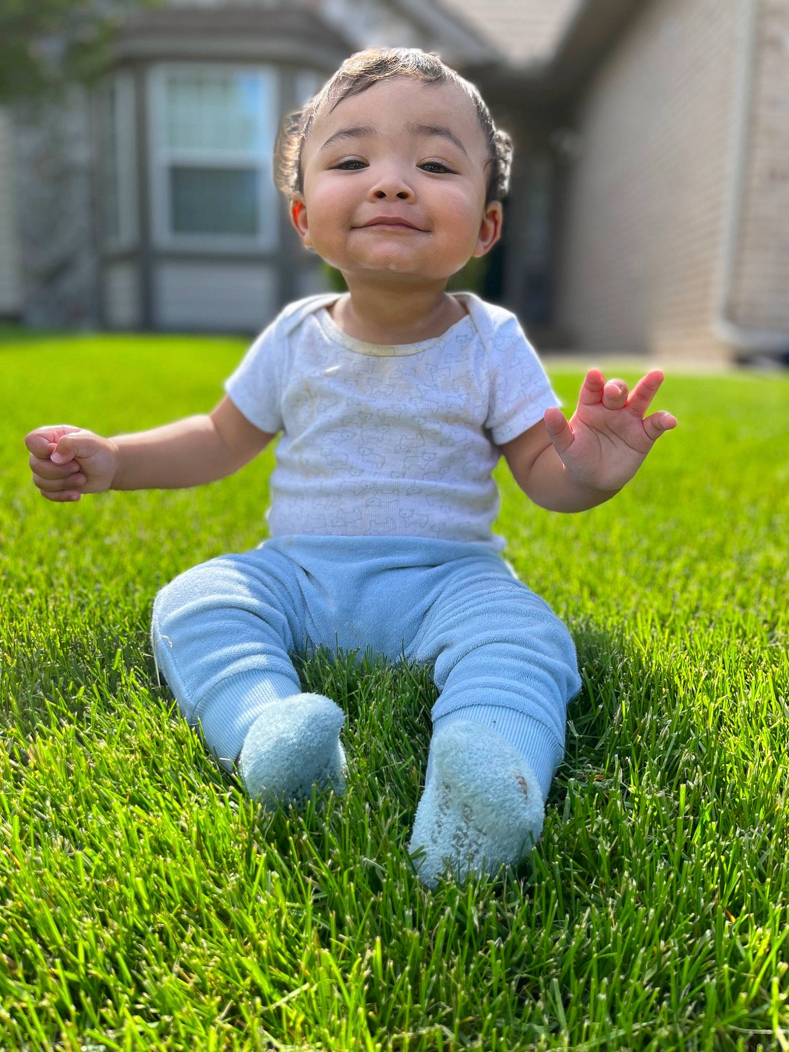 Giovanni is registered to the contest to win money with this photo: baby, baby_toddler_clothing, child, face, facial_expression, flash_photography, fun, grass, grassland, groundcover, happy, joy, lawn, leisure, meadow, people_in_nature, person, plant, playing_with_kids, smile