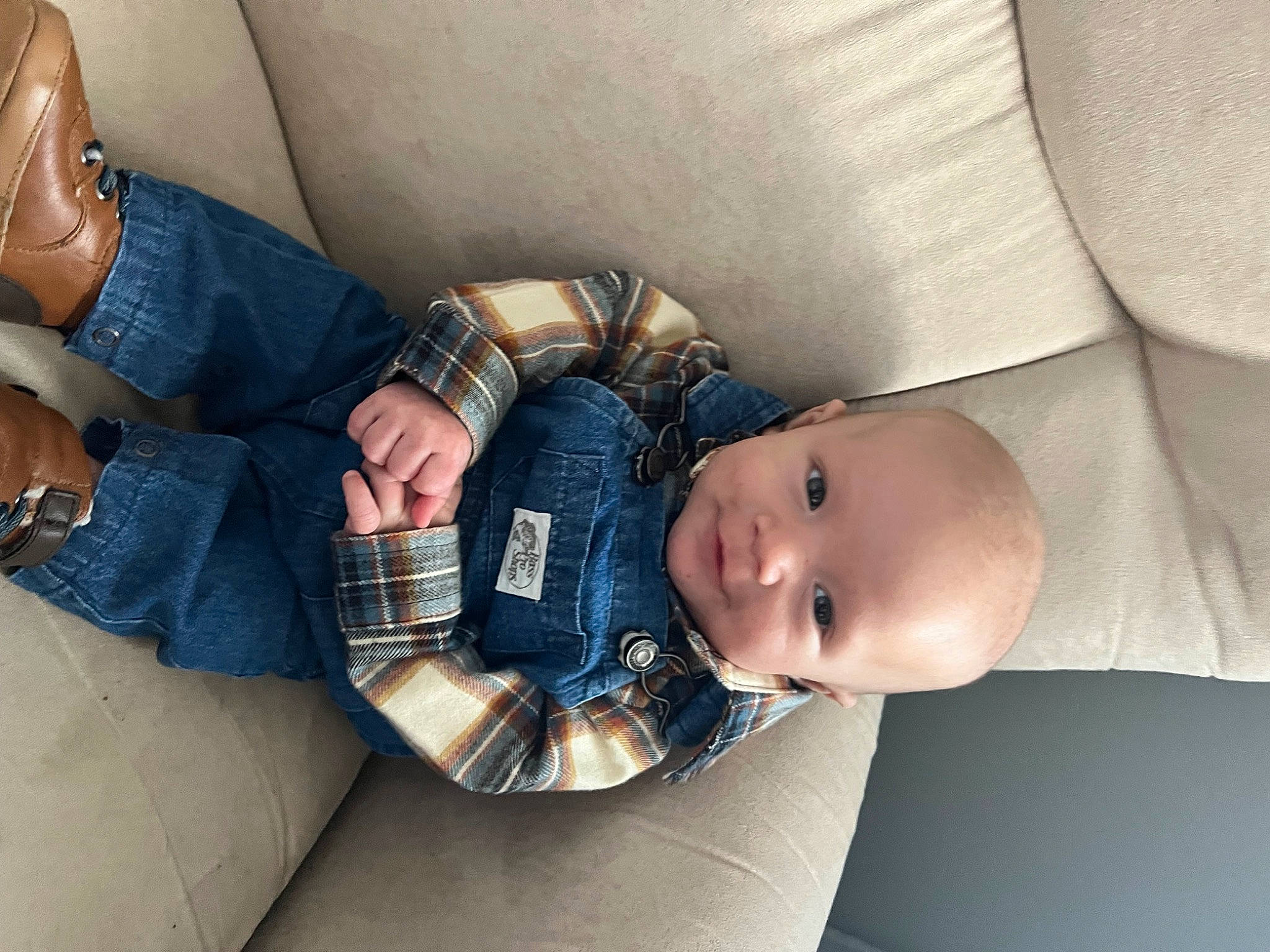Emmett is registered to the contest to win money with this photo: abdomen, arm, baby, child, comfort, elbow, eye, eyewear, finger, hand, human_leg, joint, leg, nail, person, sitting, skin, thigh, toddler, trunk