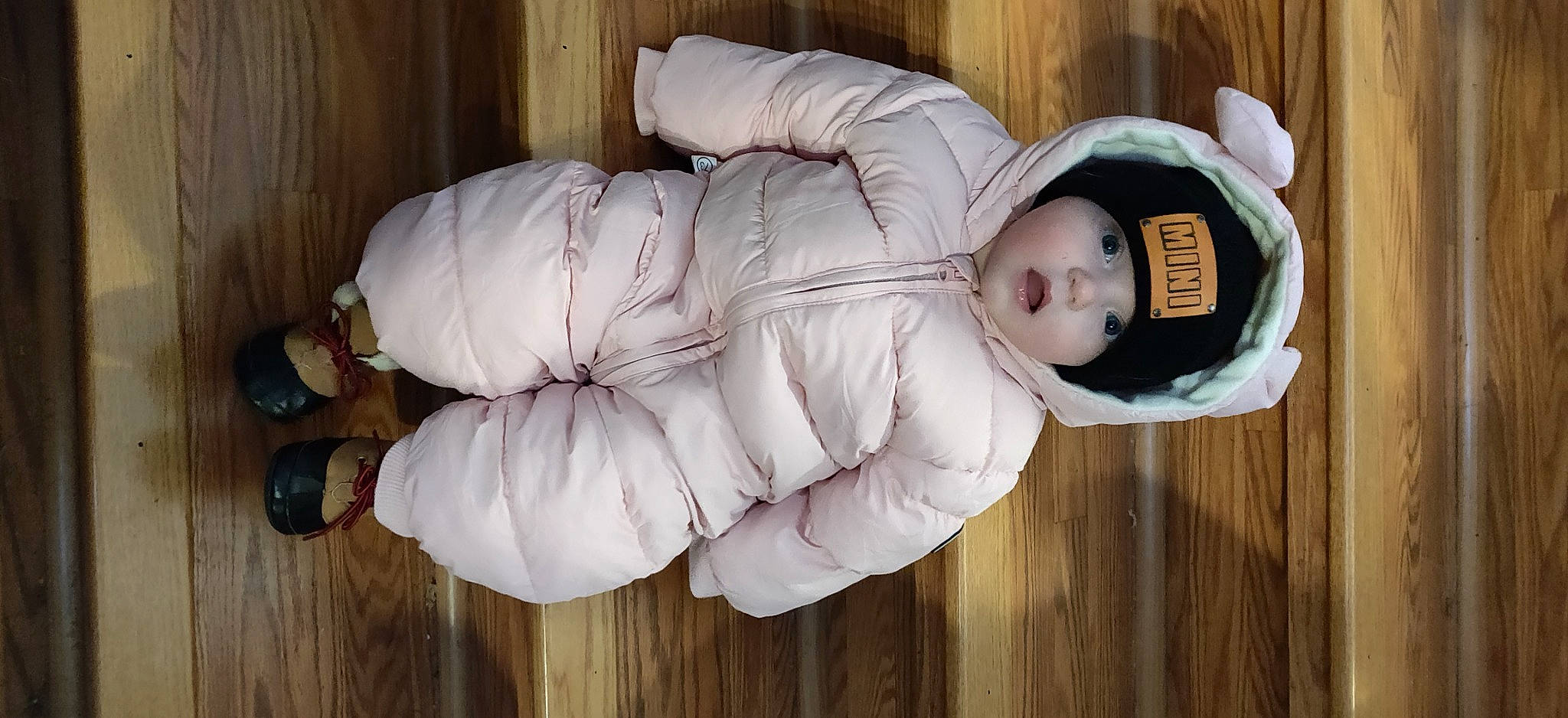 Lydia joined the competition — help win amazing prizes! baby, baby_toddler_clothing, comfort, couch, eye, flooring, fur, hardwood, headwear, person, room, sitting, toddler, varnish, wood, wood_flooring