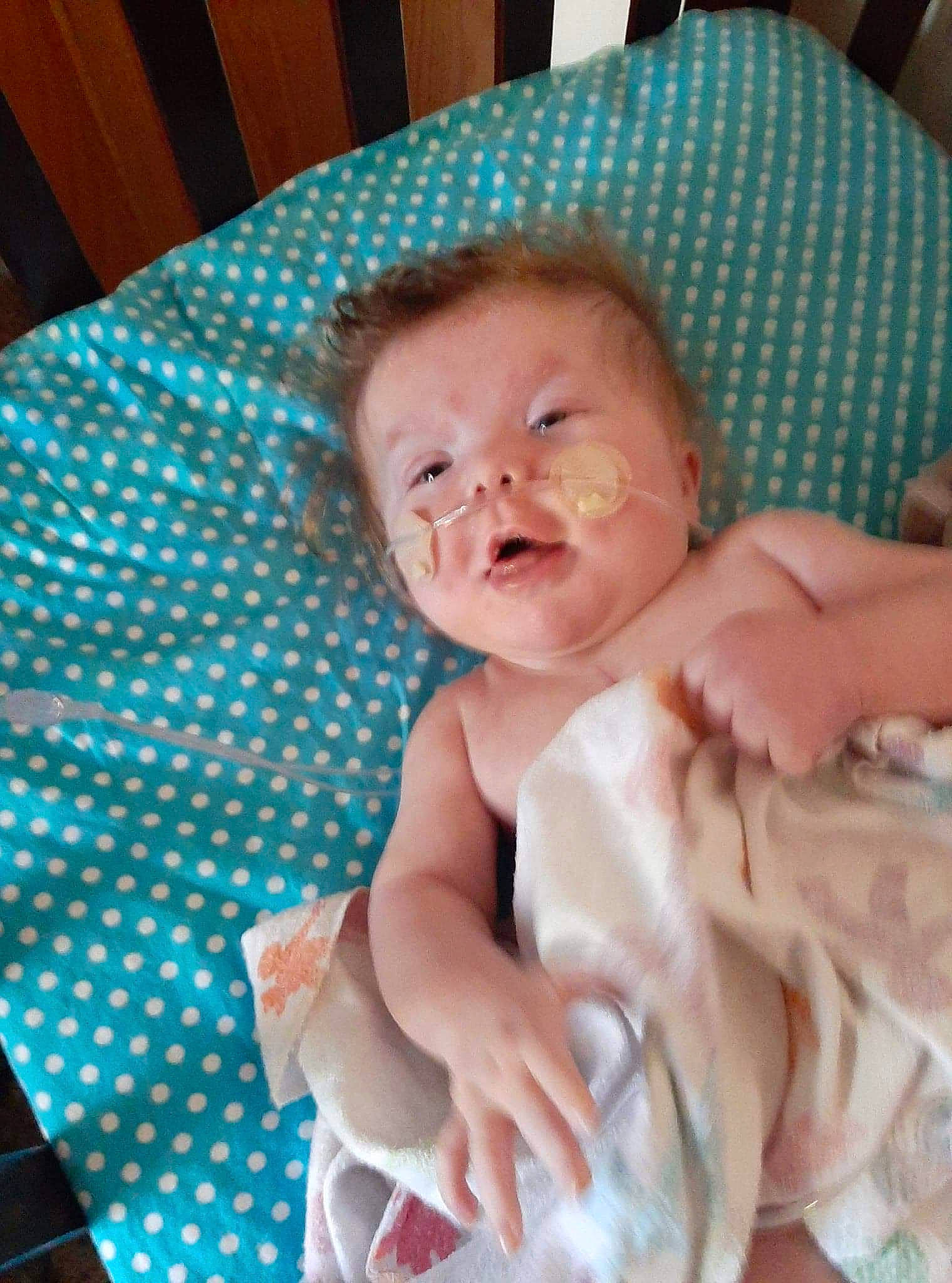 Ivan joined the competition — help win amazing prizes! baby, baby_products, baby_toddler_clothing, cheek, child, comfort, face, facial_expression, head, iris, linens, pattern, person, room, sitting, skin, smile, table, thumb, toddler