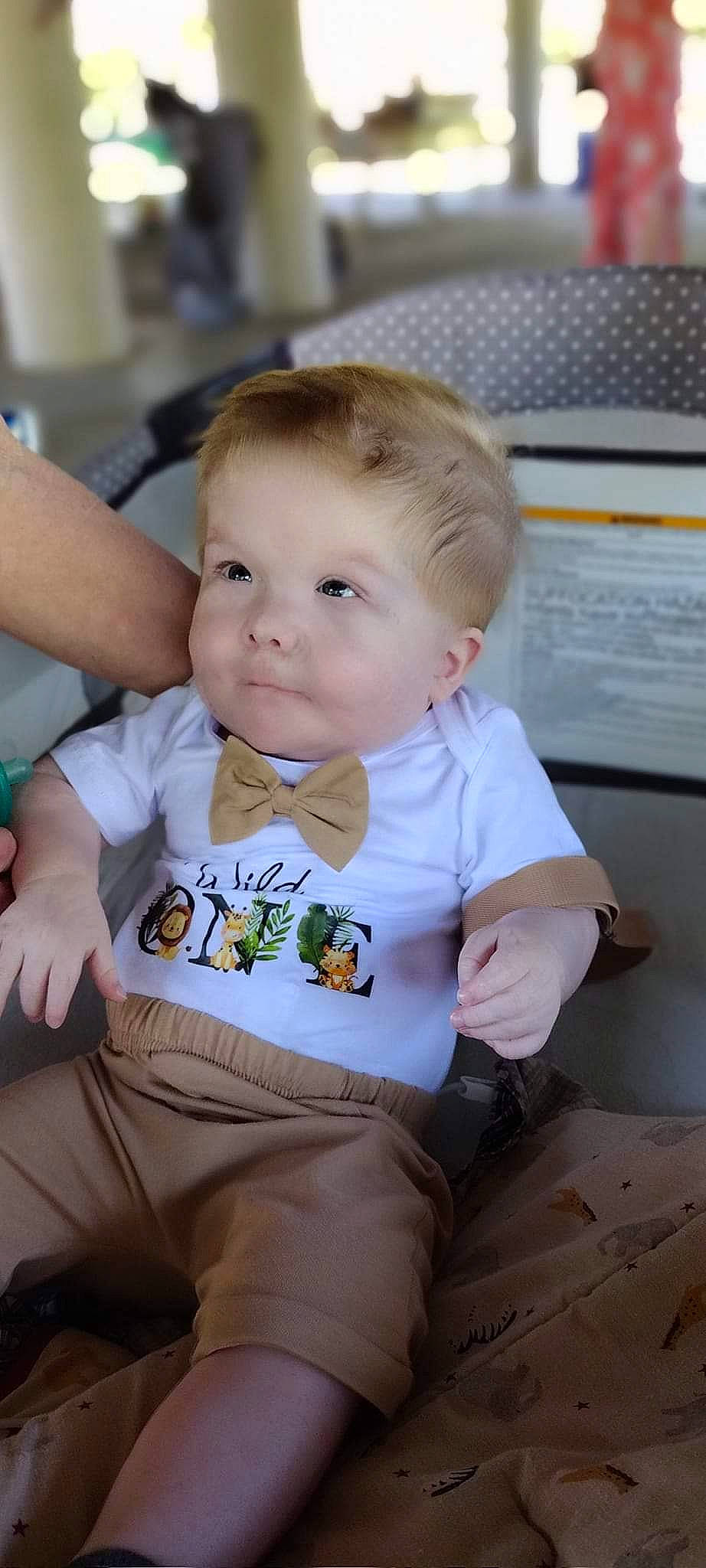 Ivan is registered to the contest to win money with this photo: arm, baby, baby_toddler_clothing, chair, cheek, child, chin, comfort, eye, finger, fun, happy, human_body, iris, nose, person, sitting, skin, sleeve, t_shirt