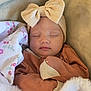 Azalea is registered to the contest to win money with this photo: baby, blanket, bow, child, clothing, cozy, cute, face, headband, indoors, infant, newborn, peaceful, portrait, resting, sleeping, soft, toddler, warm, wrapped