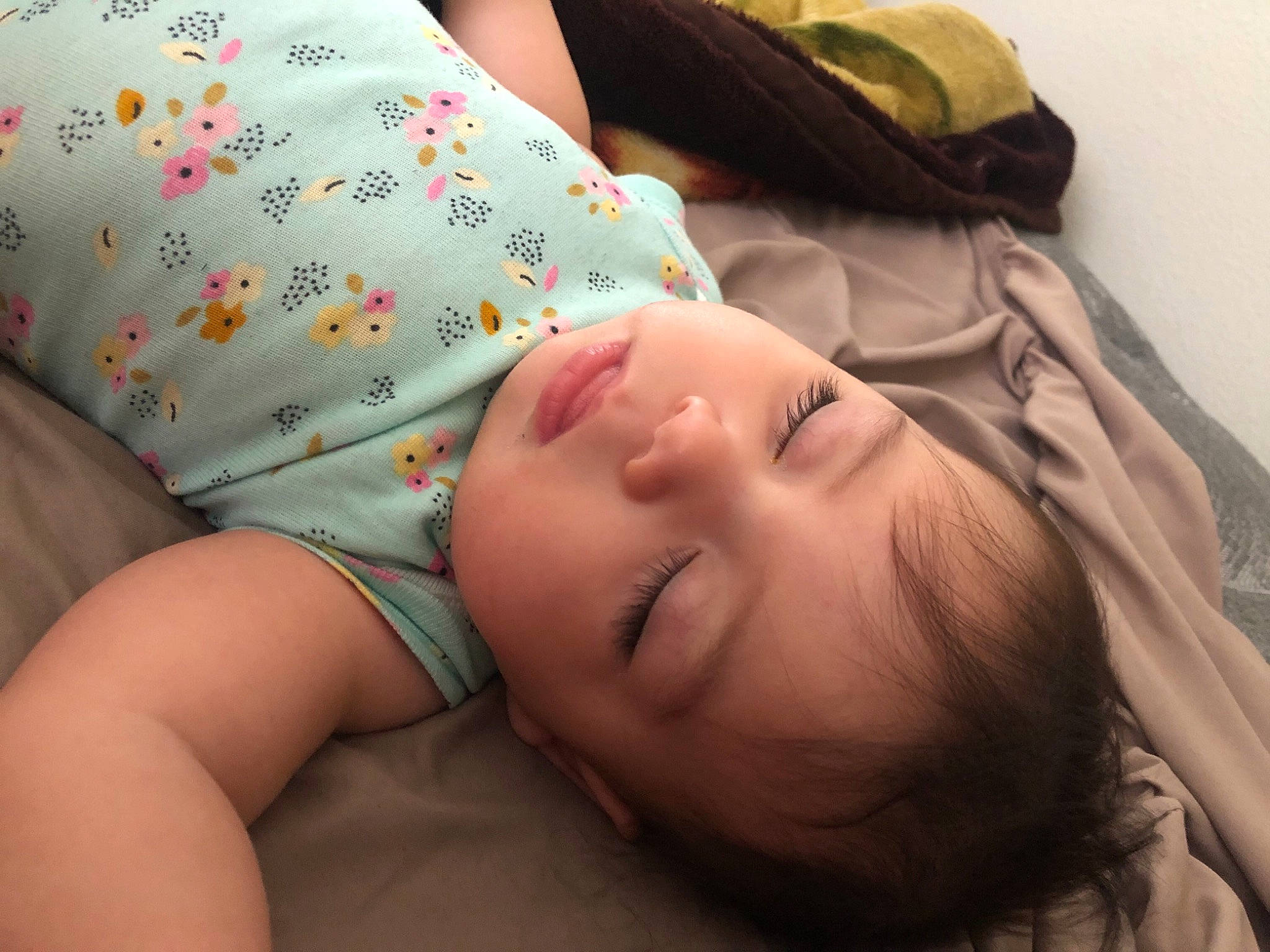 Elsie is registered to the contest to win money with this photo: arm, baby, baby_toddler_clothing, cheek, child, comfort, finger, grass, hand, happy, head, headgear, human_body, lip, mouth, nose, person, skin, sleeve, toddler