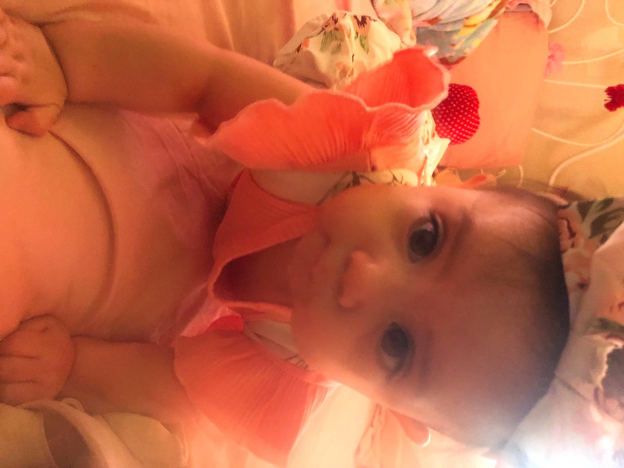 Elsie is registered to the contest to win money with this photo: arm, baby, cheek, ear, eyelash, finger, hand, head, headgear, human, human_body, iris, lip, mouth, muscle, neck, nose, orange, person, pink