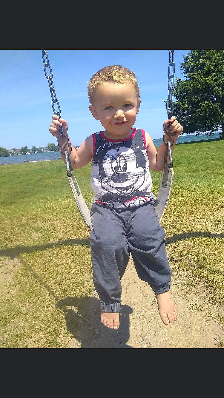 Carson joined the competition — help win amazing prizes! arm, baby_toddler_clothing, finger, fun, gesture, grass, hand, happy, joy, leisure, outdoor_play_equipment, people_in_nature, person, playground, recreation, sky, smile, swing, t_shirt, thumb