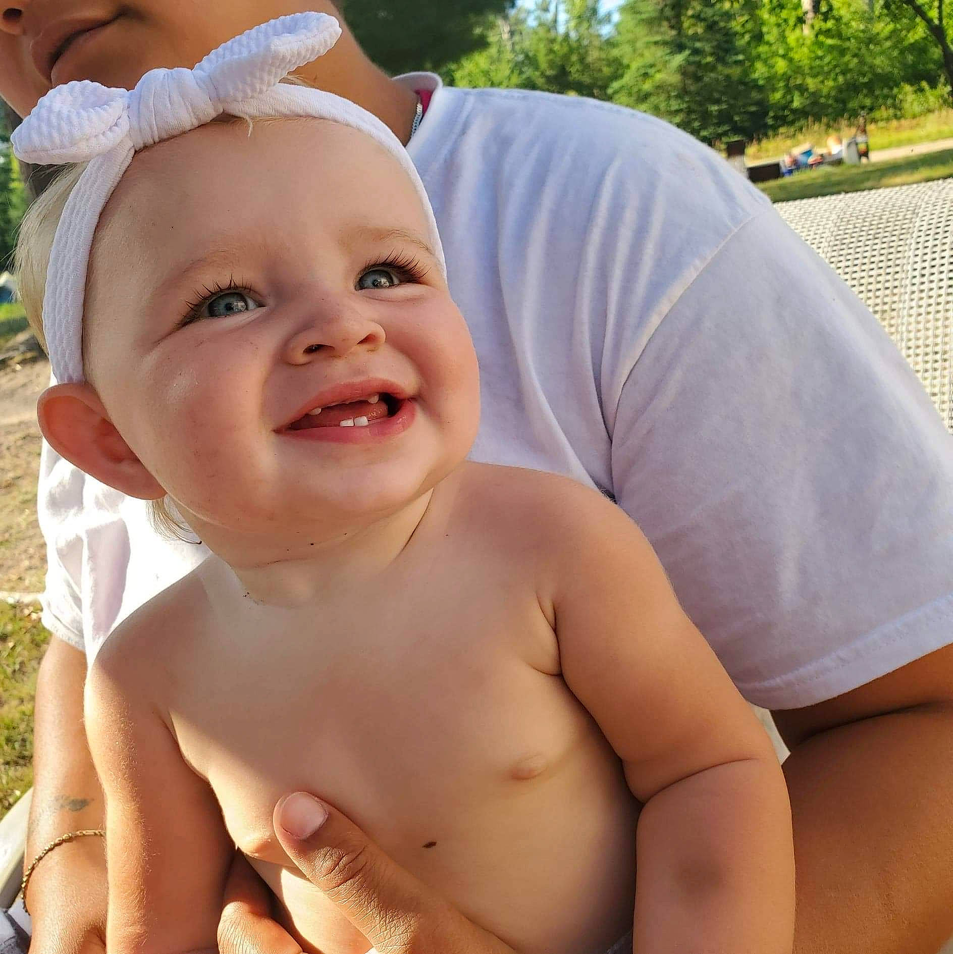 Ansley joined the competition — help win amazing prizes! baby, baby_laughing, cheek, cool, eye, finger, gesture, grass, hand, happy, human_body, joy, leg, lip, mouth, muscle, nose, people_in_nature, person, plant