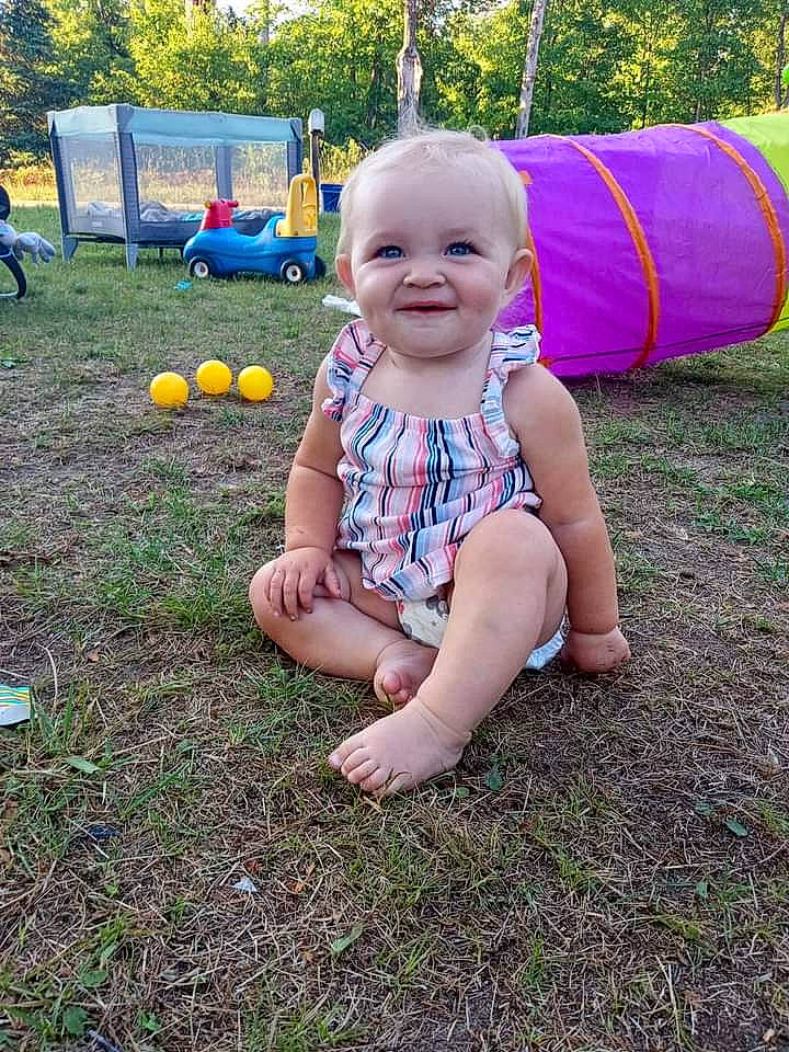 Ansley joined the competition — help win amazing prizes! baby, baby_toddler_clothing, ball, child, fun, garden, grass, happy, joy, lawn, leisure, outdoor_play_equipment, people_in_nature, person, plant, play, playground, recreation, sitting, smile